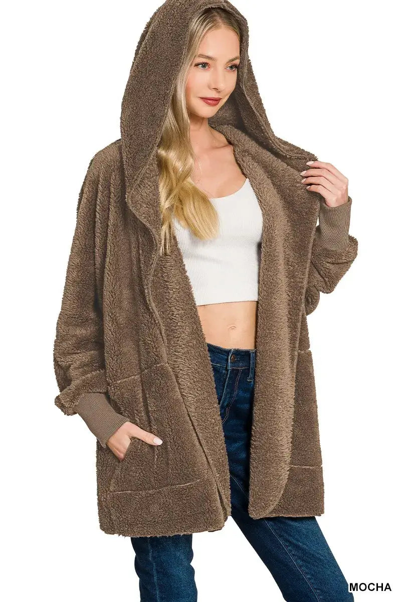 Zenana Hooded Faux Fur Jacket with Pockets in mocha color, featuring a cozy design and spacious pockets.