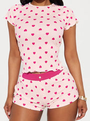 Heart Print Top and Shorts Loungewear Set featuring pink fabric with heart patterns, slightly stretchy material for comfort.