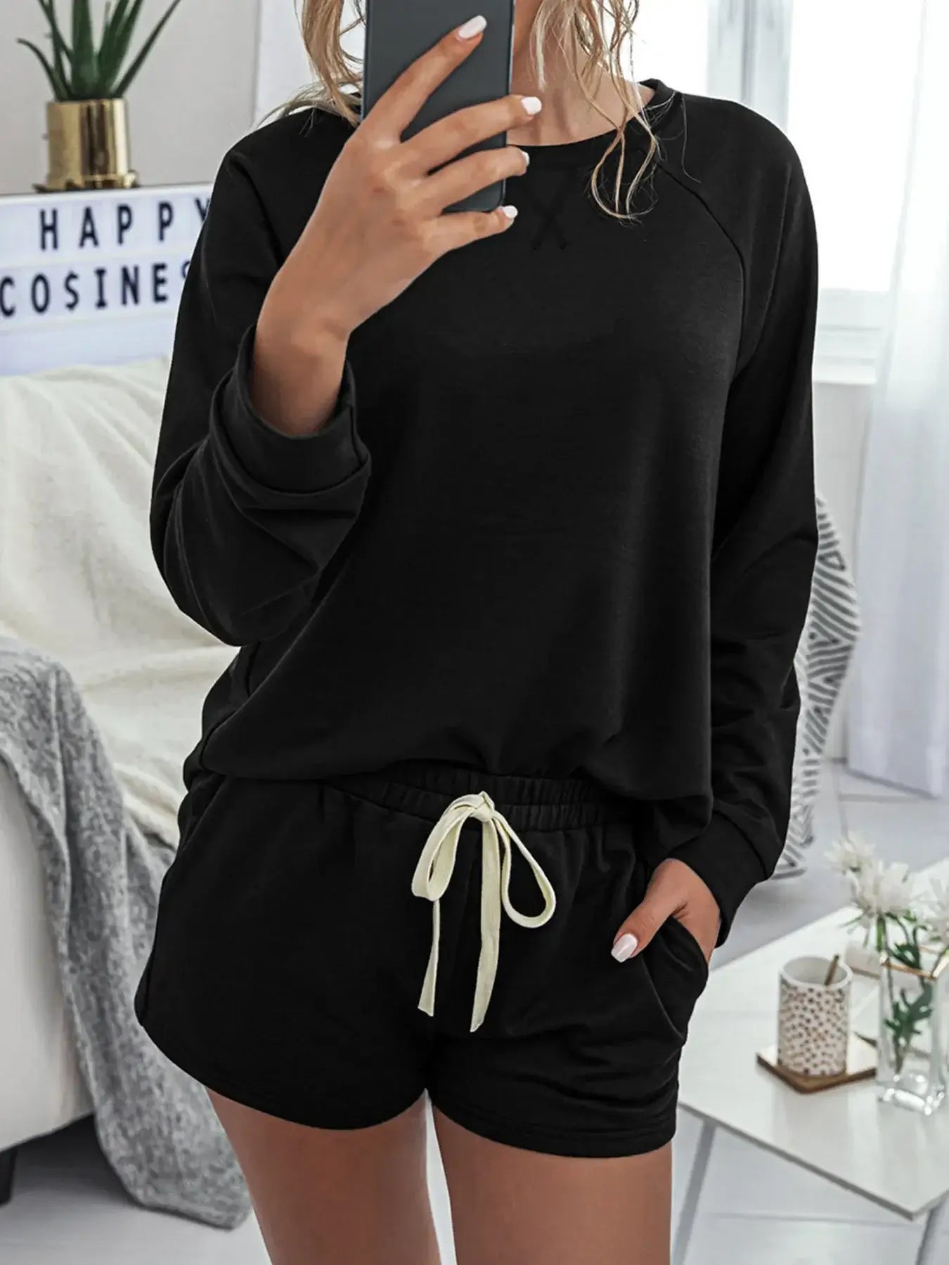 Round Neck Raglan Sleeve Top and Shorts Lounge Set worn by a model showcasing the relaxed fit and drawstring details.