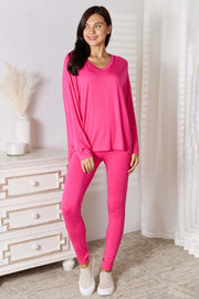 Basic Bae Full Size V-Neck Soft Rayon Long Sleeve Top and Pants Lounge Set in vibrant pink color on a model.