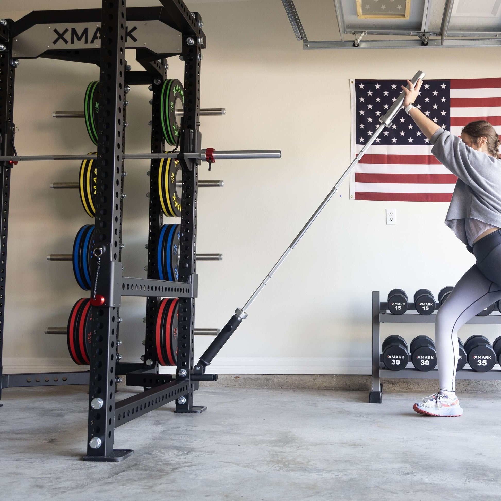 Viper Attachment Package 1 workout featuring a landmine exercise with XMARK rack and plates in a garage gym setting.