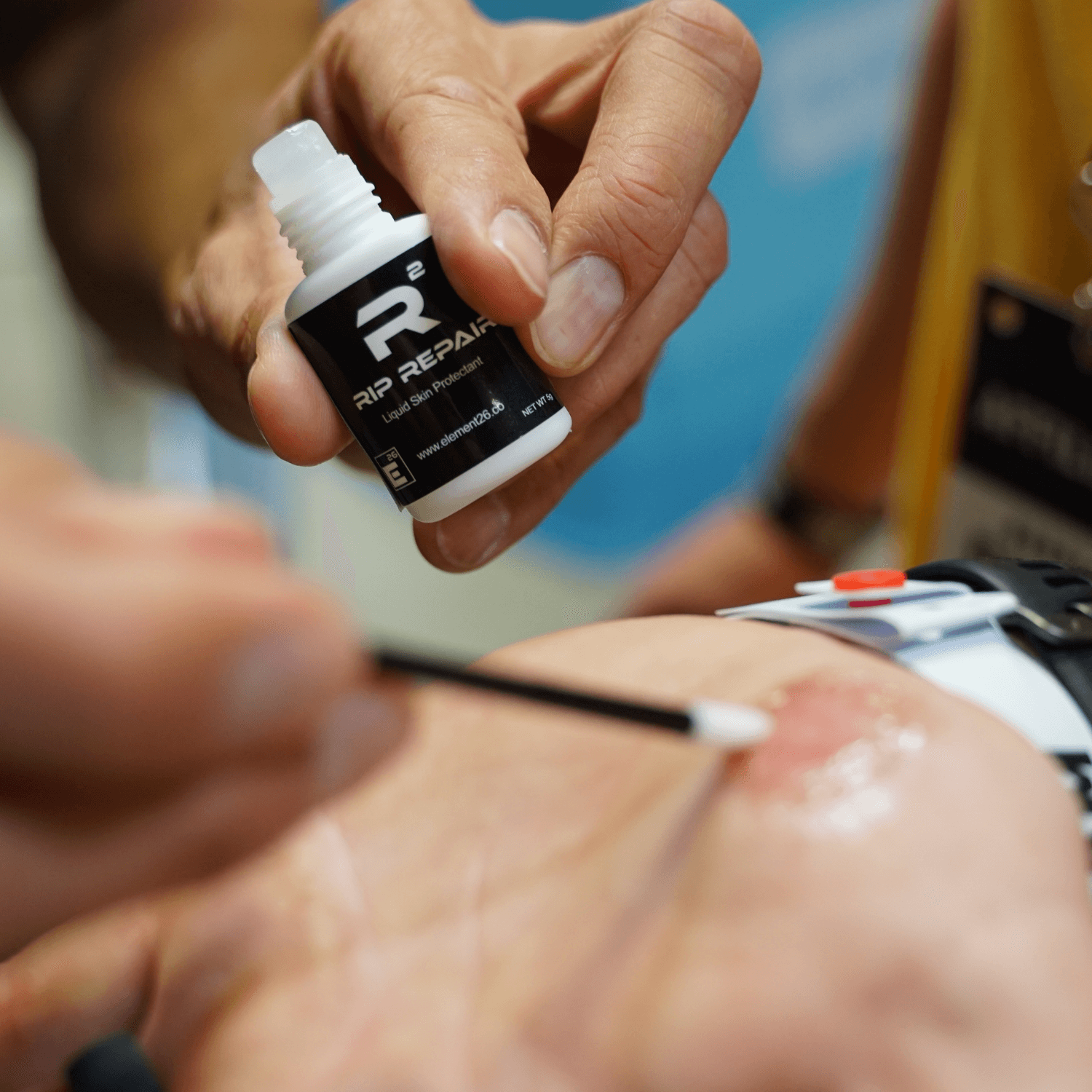Rip Repair Skin Protectant being applied to skin with a cotton swab, showcasing fast-drying skin protection.