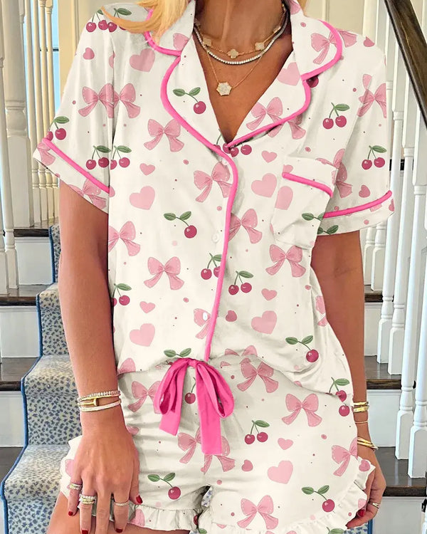 Floral Printed Button Up Short Sleeve Top and Shorts Lounge Set, featuring pink bows and hearts, perfect for lounging.