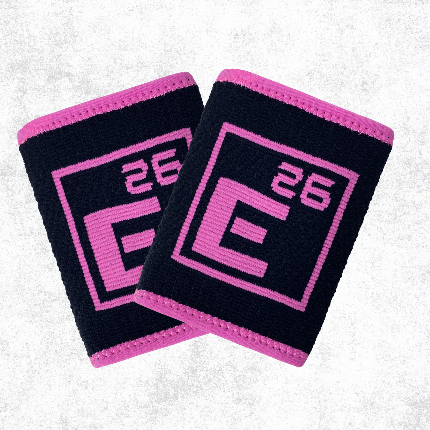 Wrist Sweat Bands by Element 26 in navy and pink for enhanced grip and performance during workouts.