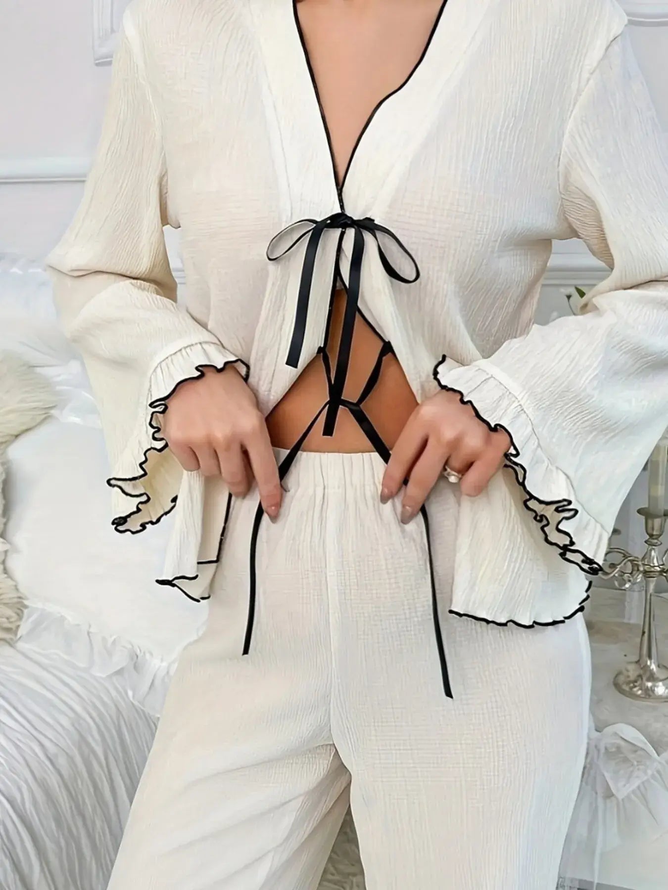 Frill Trim Bow Tie Shirt and Pants Lounge Set featuring a tied top and ruffled sleeves in a stylish lounge setting.