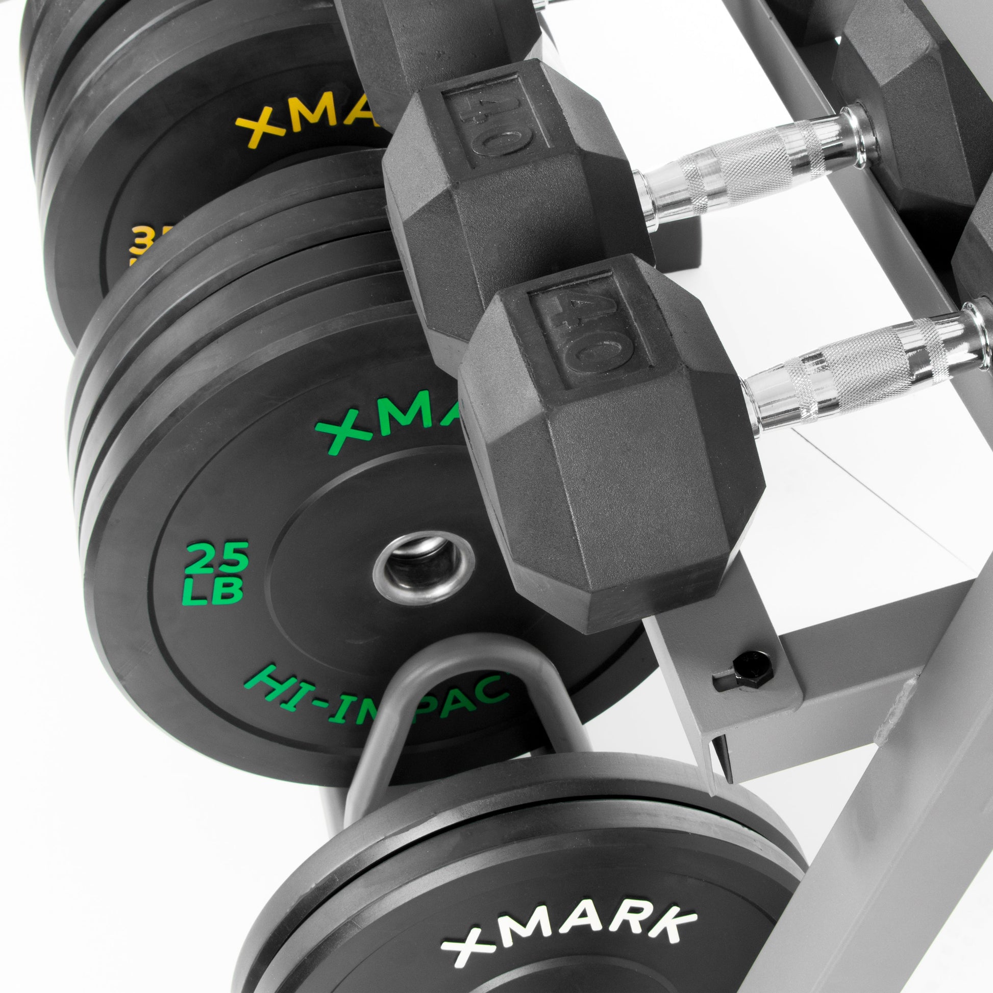 All-In-One Storage For Dumbbells Weight Plates and Barbells with dumbbells and weight plates stacked.