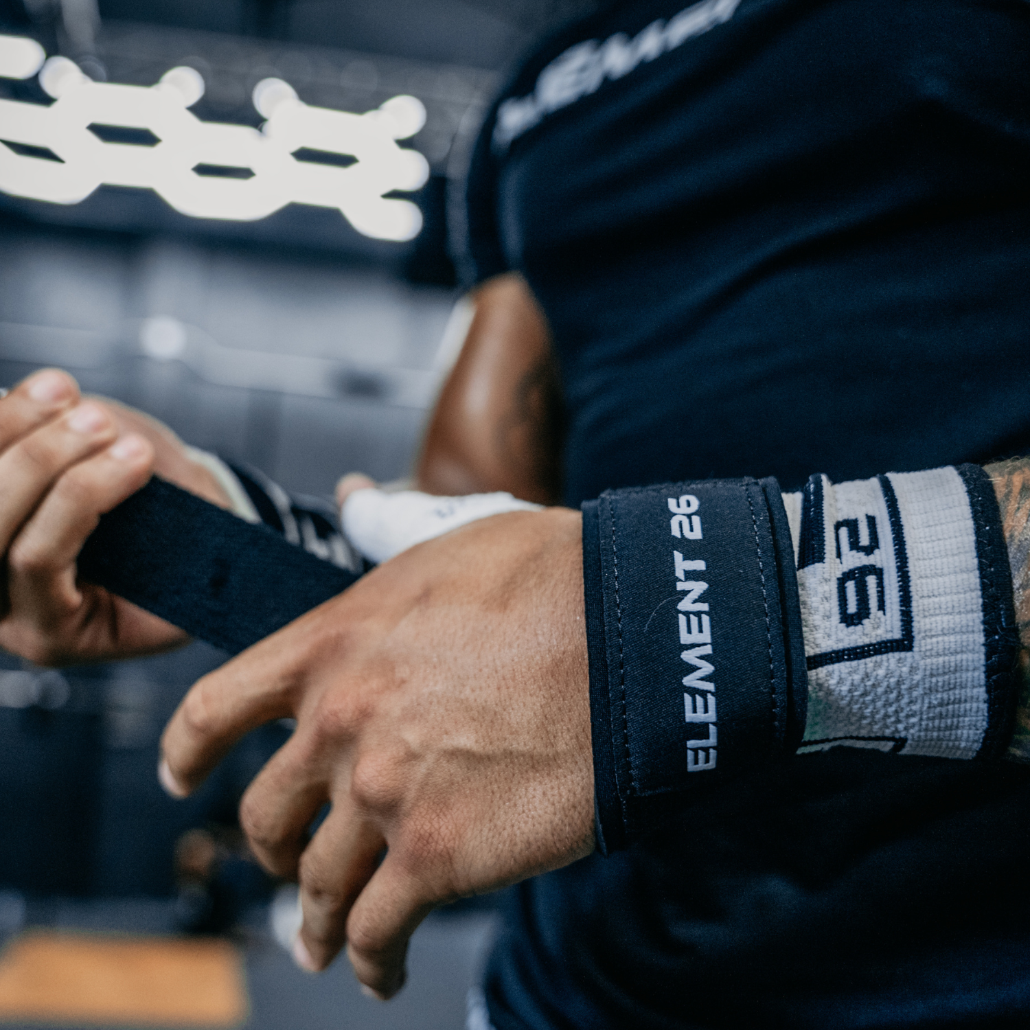 Weight Lifting Straps being wrapped around a lifter's wrist for enhanced grip and support during workouts.