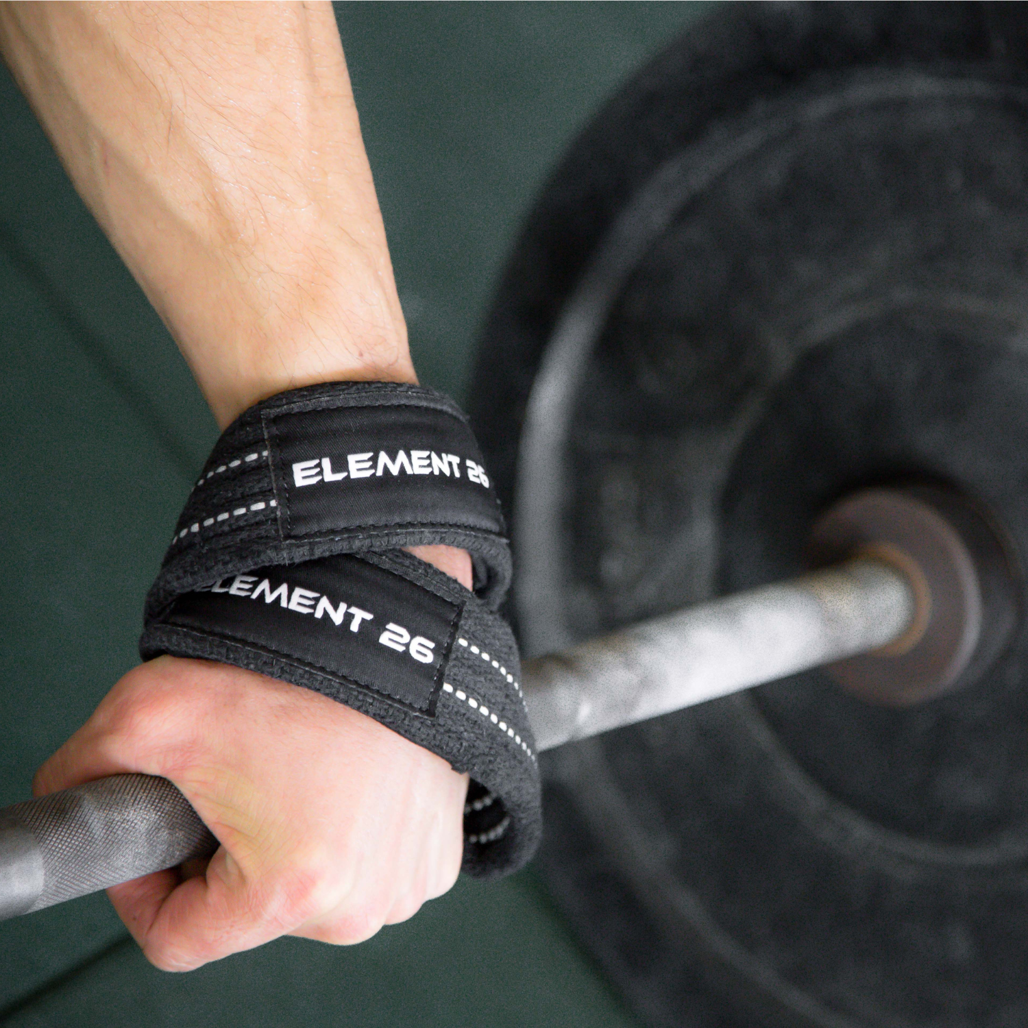 Padded Figure 8 Weightlifting Straps in use during a weightlifting exercise, providing wrist support and grip stability.