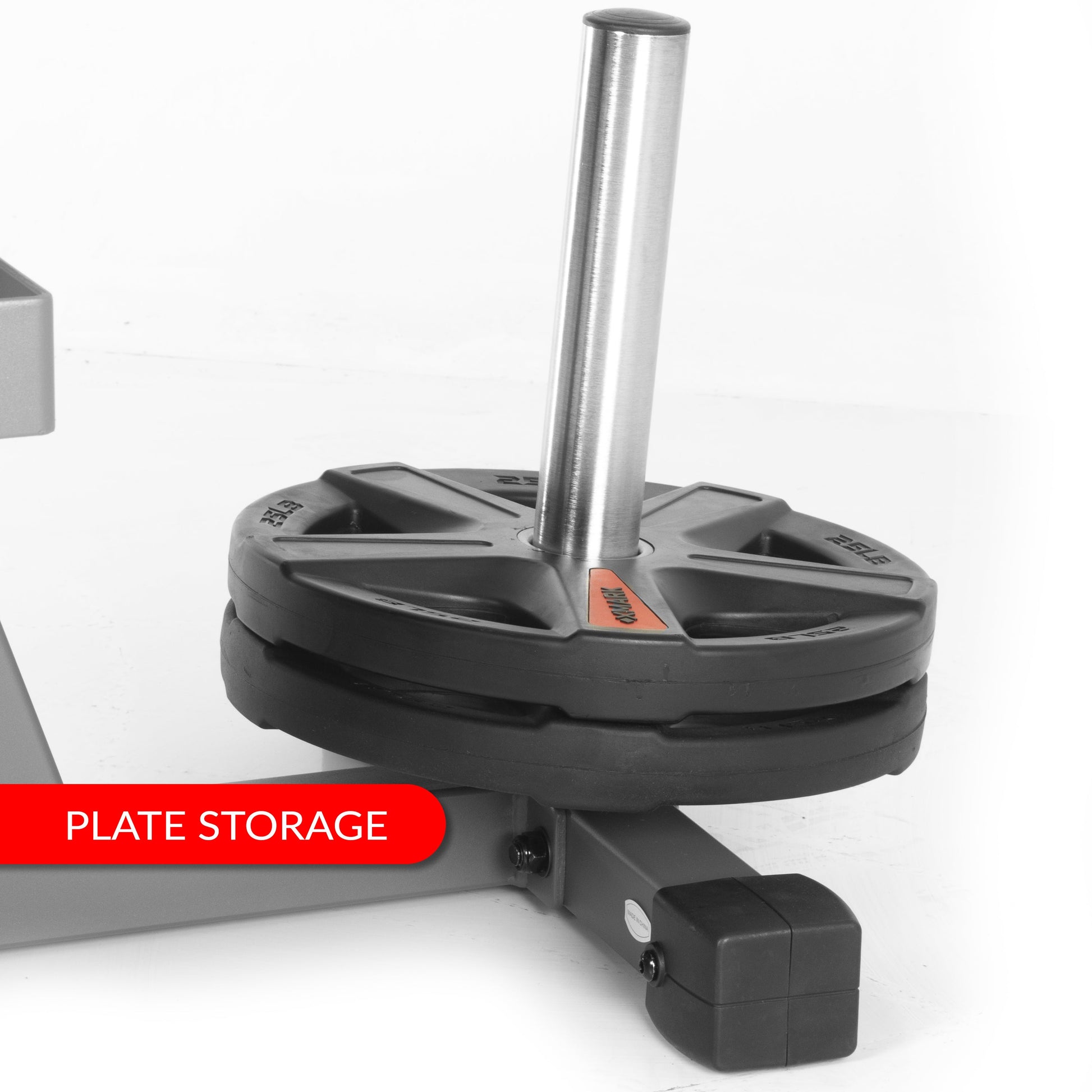 Plate storage feature on a Rotary Leg Extension Curl Machine with a weight plate attached.
