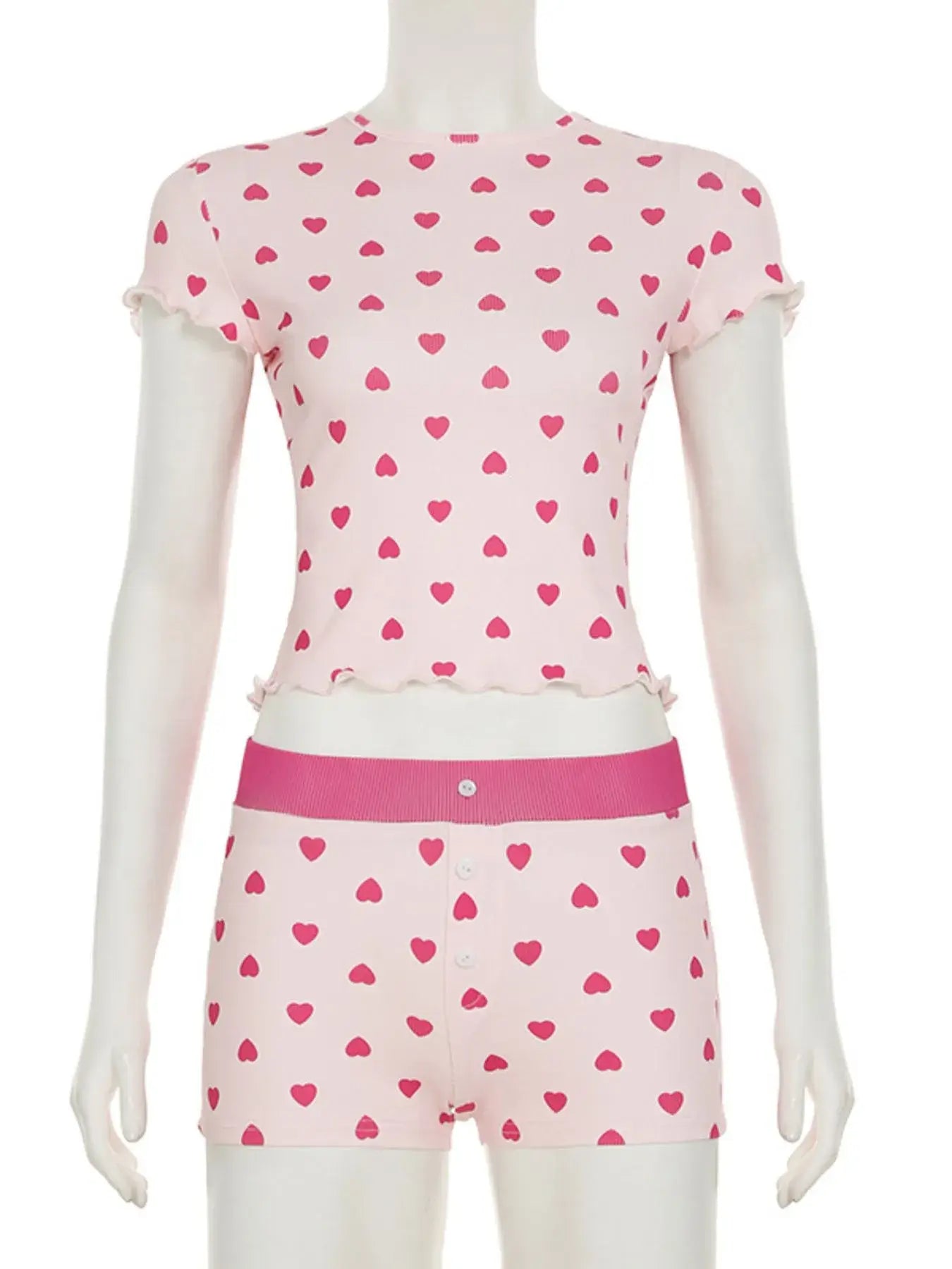 Heart Print Top and Shorts Loungewear Set displayed on a mannequin, featuring a pink top and matching shorts with heart patterns.