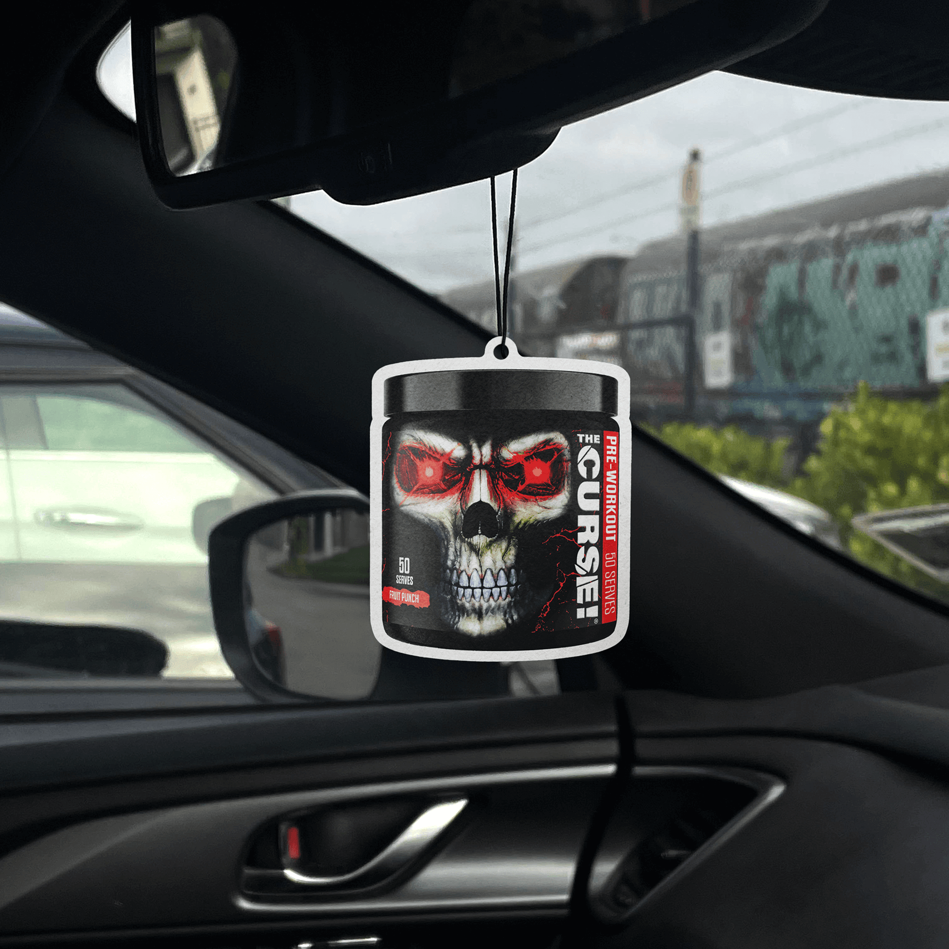 JNX Sports Air Fresheners hanging in a car showcasing a skull design with red details.