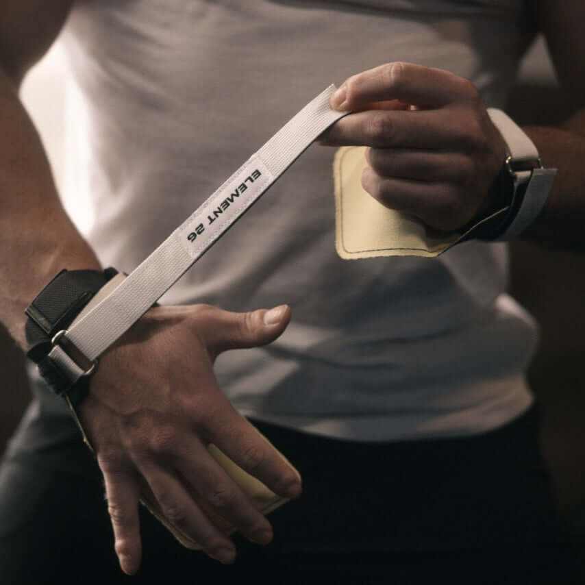 Isocomp Gymnastic Hand Grips featuring dual surface technology and Kevlar palm coating for optimal grip.