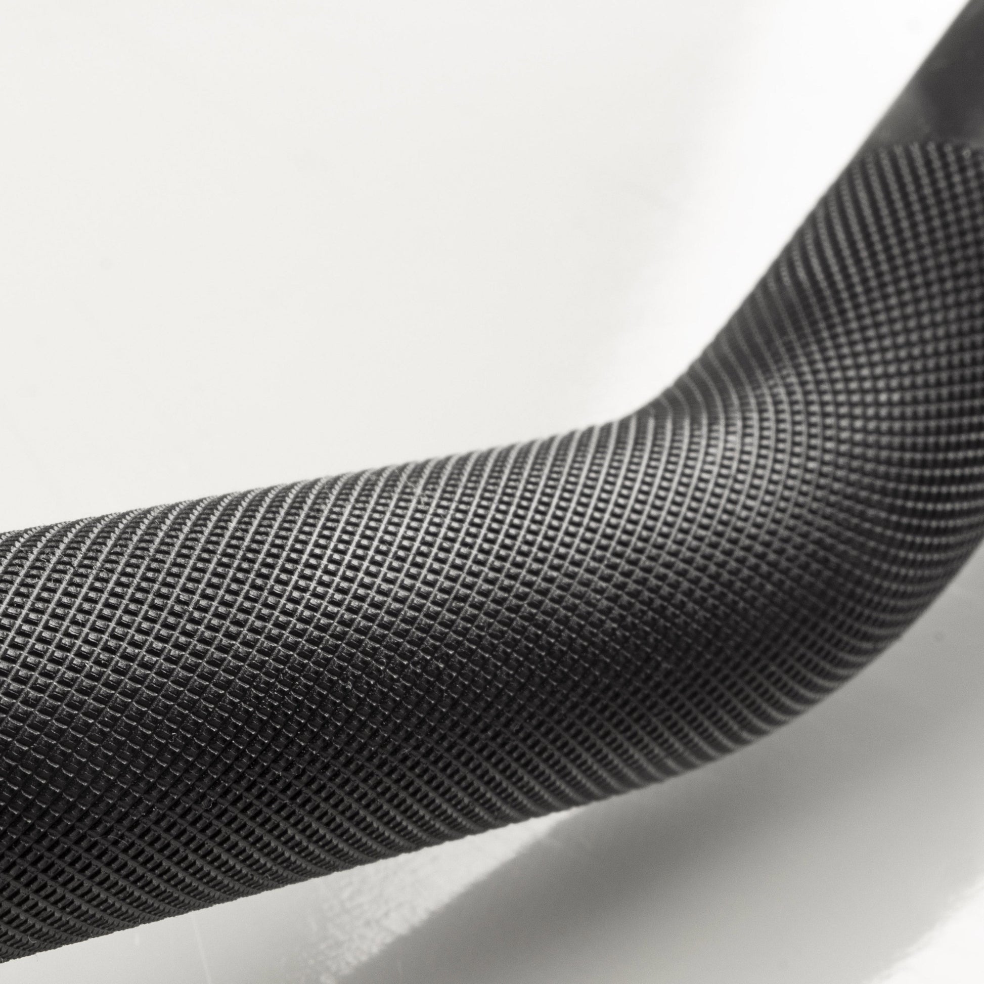 Close-up of the textured grip of the Crowbar EZ Curl Barbell Fits Olympic Plates.