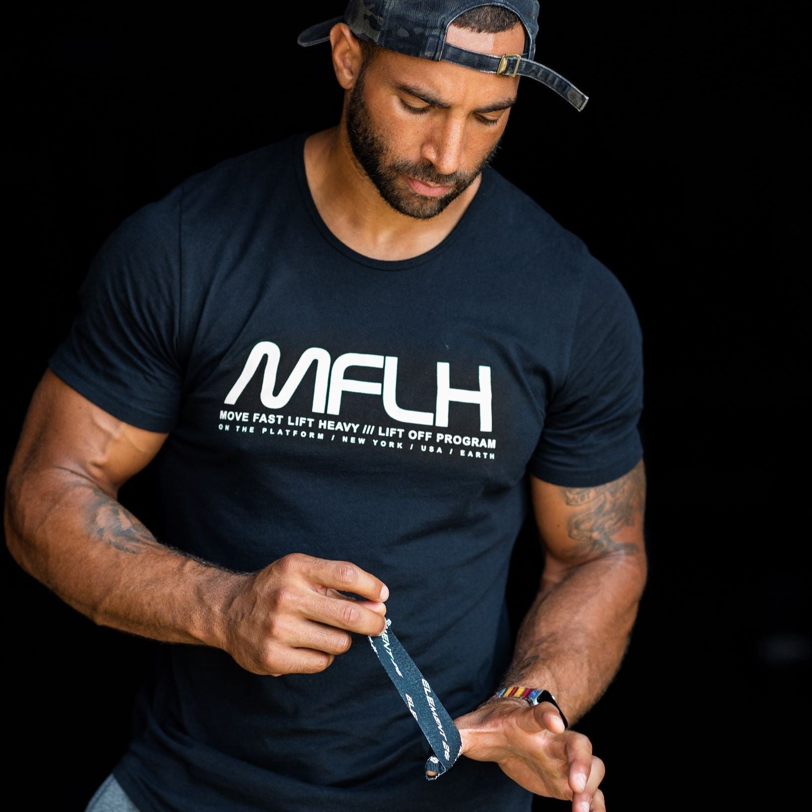 Athlete applying Weightlifting Tape for optimal grip and performance during workout.