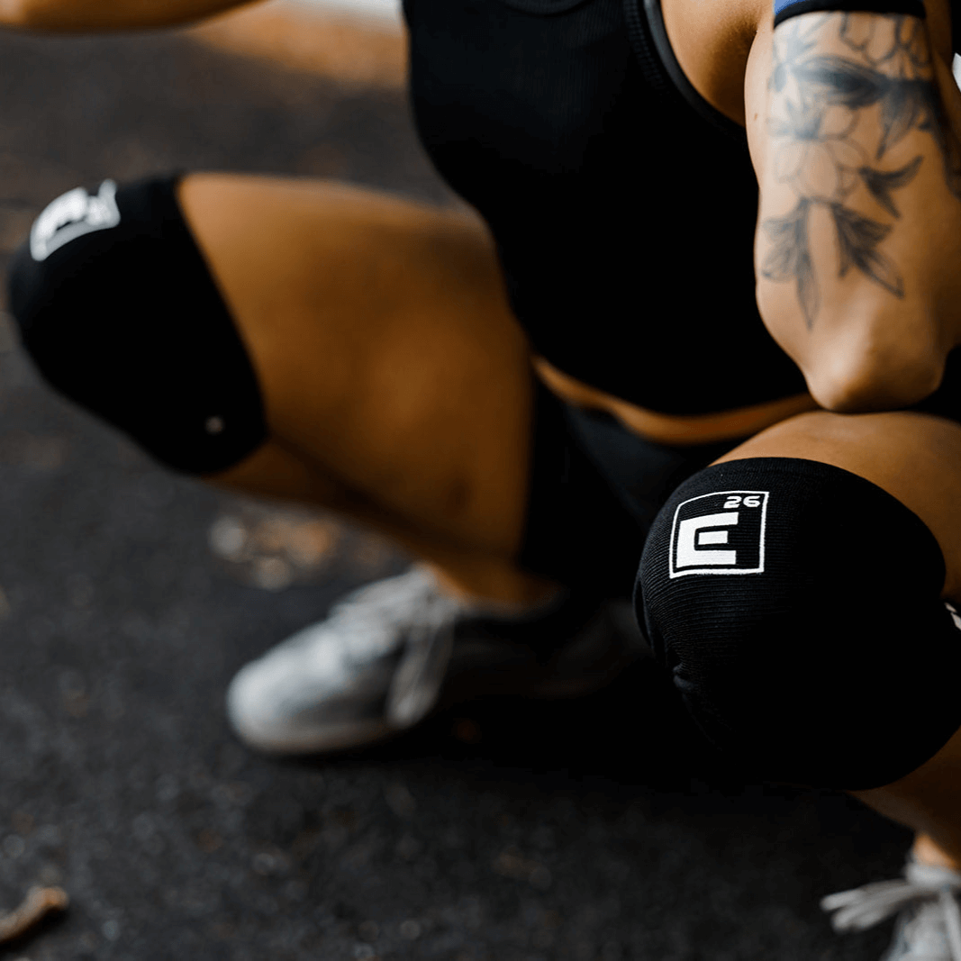Person wearing 3mm Agility Knee Sleeves during a squat for joint protection and comfort.