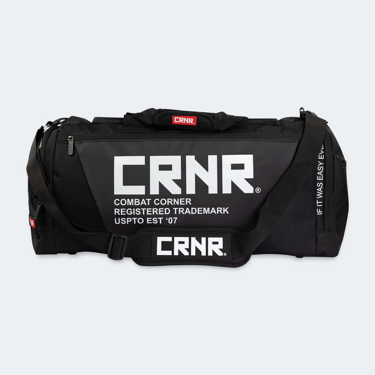 Essential Gear Duffel Bag by COMBAT CORNER featuring a sleek black design and functional compartments.