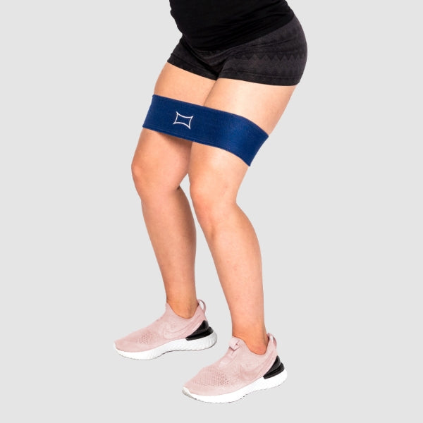 Person using a Hip Circle Resistance Band for lower body workouts, focusing on hip and glute activation.