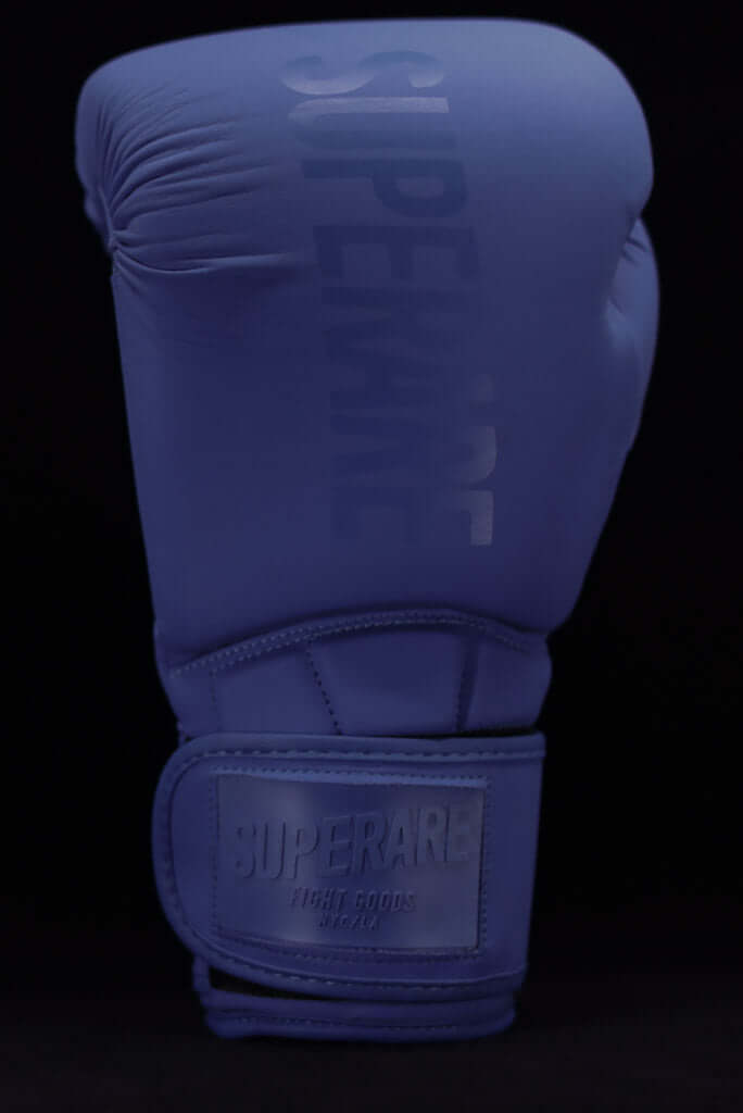 Superare Supergel V Boxing Gloves in blue featuring a sleek design and firm padding for ultimate performance.