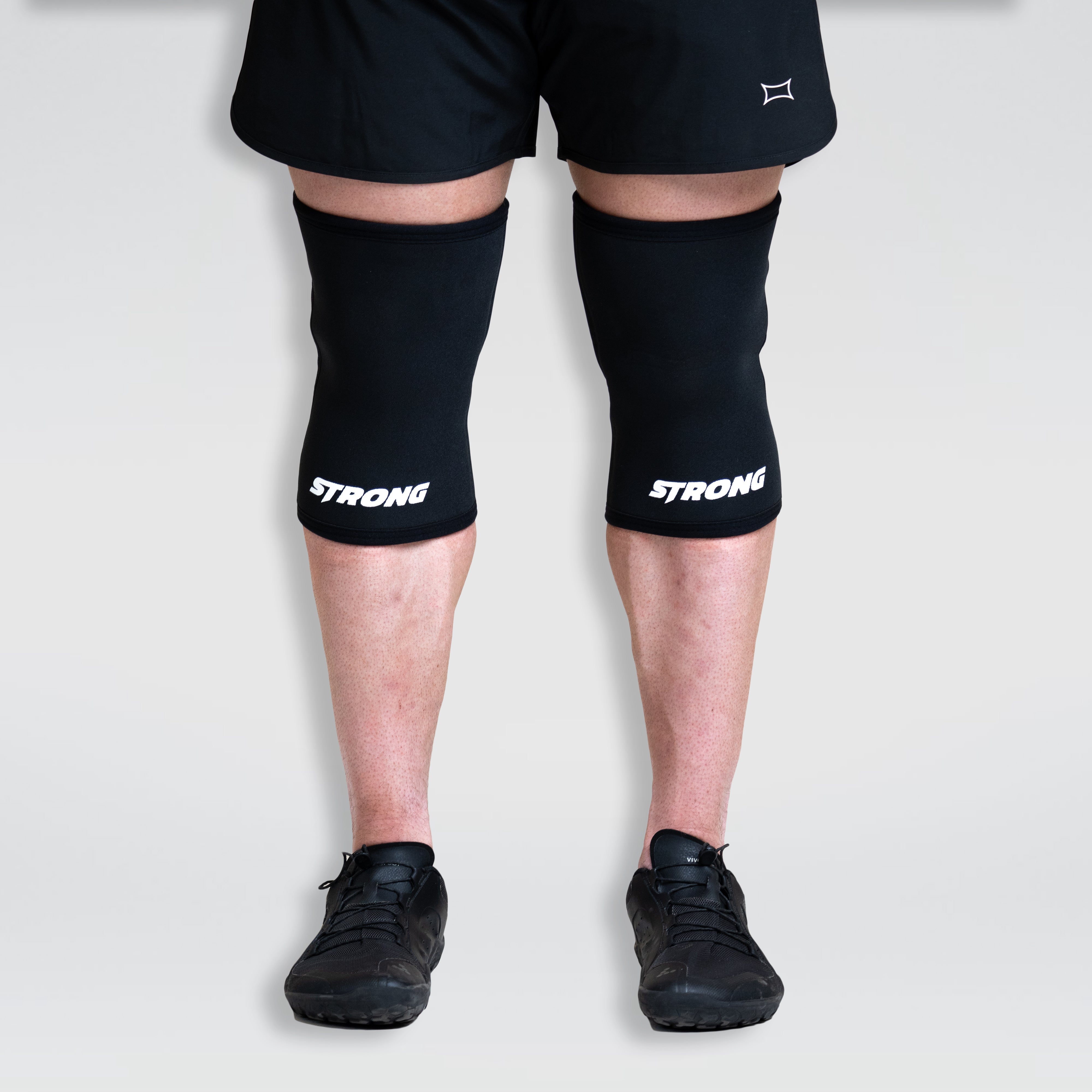 Strong Knee Sleeves providing support and compression during lower body workouts on a person.