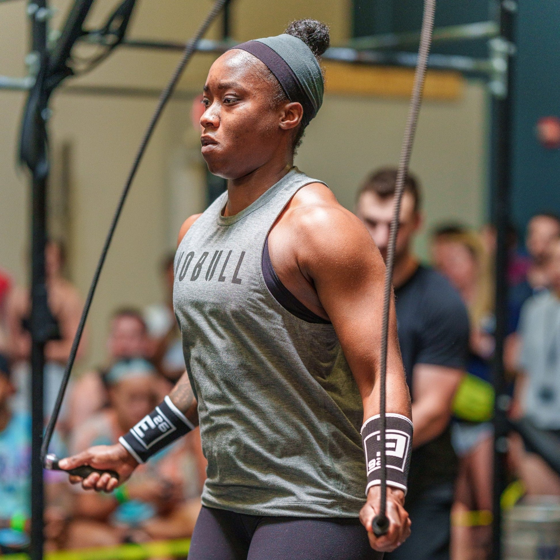 Wrist Sweat Bands worn during workout for improved grip and performance in functional fitness.