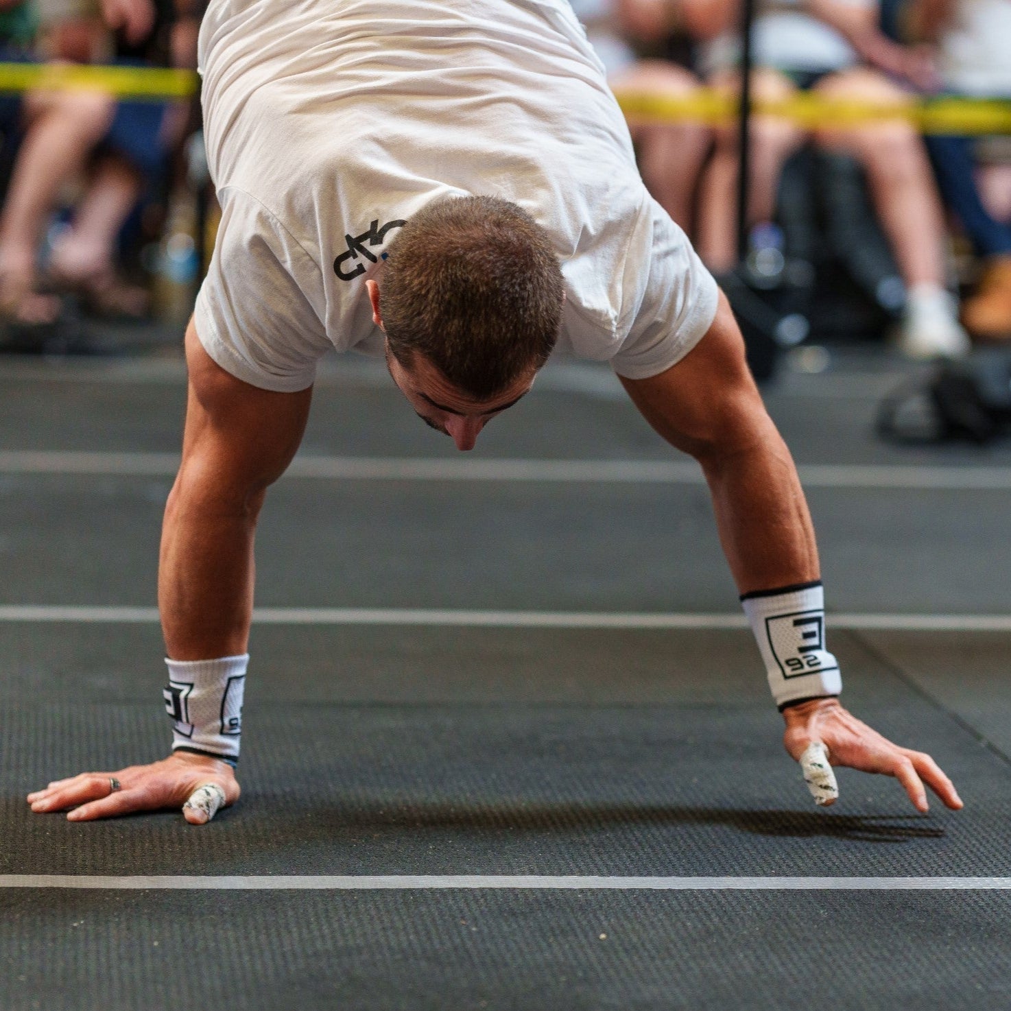 Athlete using Wrist Sweat Bands during workout for better grip and sweat management
