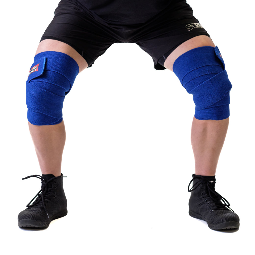 Sling Shot Knee Wraps providing support during a squat, perfect for athletes in performance training.