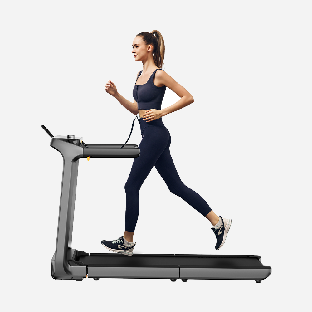 Woman jogging on a WalkingPad X218 Foldable Treadmill showcasing its sleek design and high-speed performance.