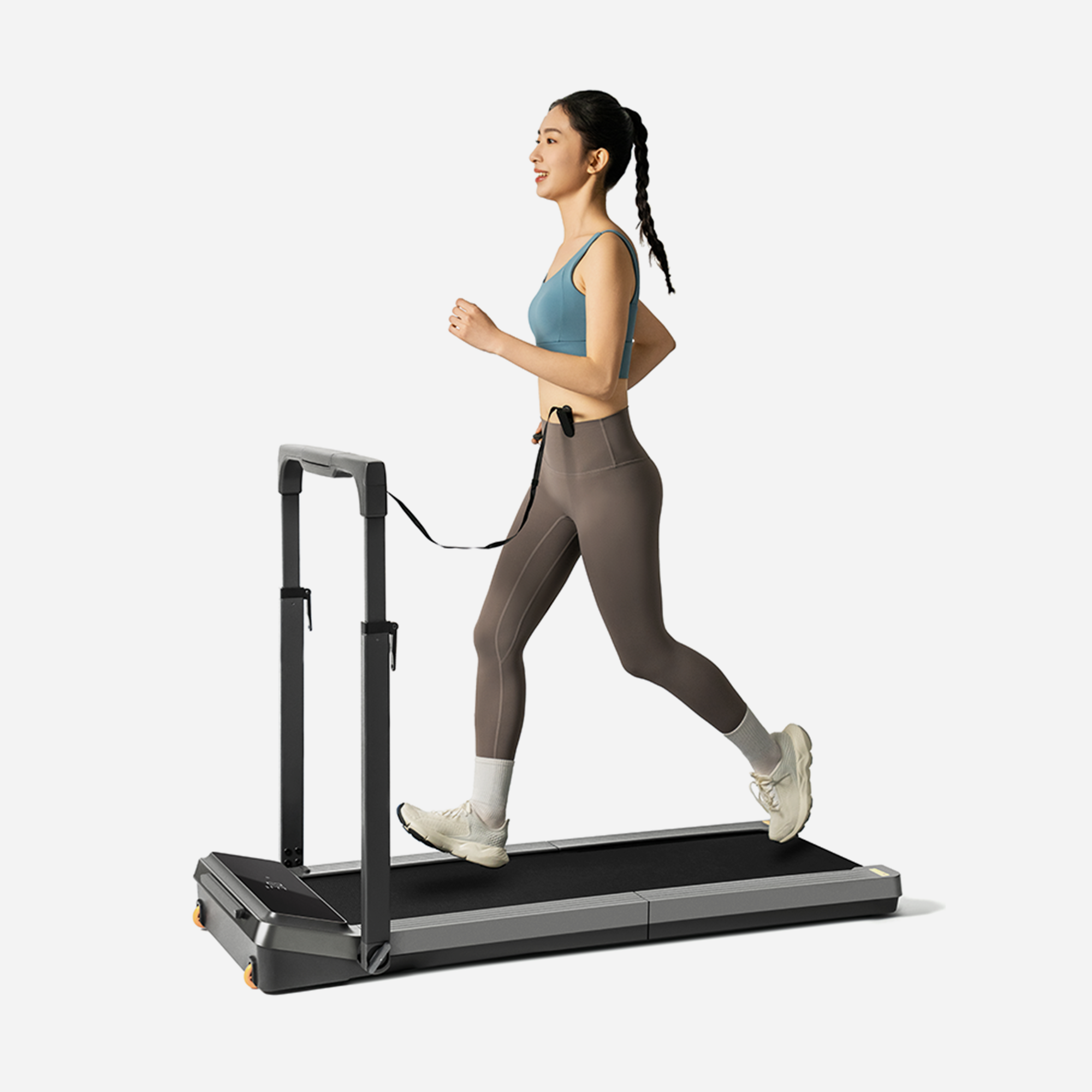 Person jogging on the WalkingPad Z3 Hybrid Foldable Treadmill in a home environment.
