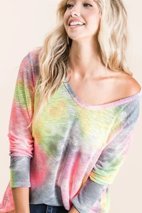 BiBi Tie Dye Print Low Gauge Knit Top worn by a smiling woman, showcasing a colorful and trendy design.