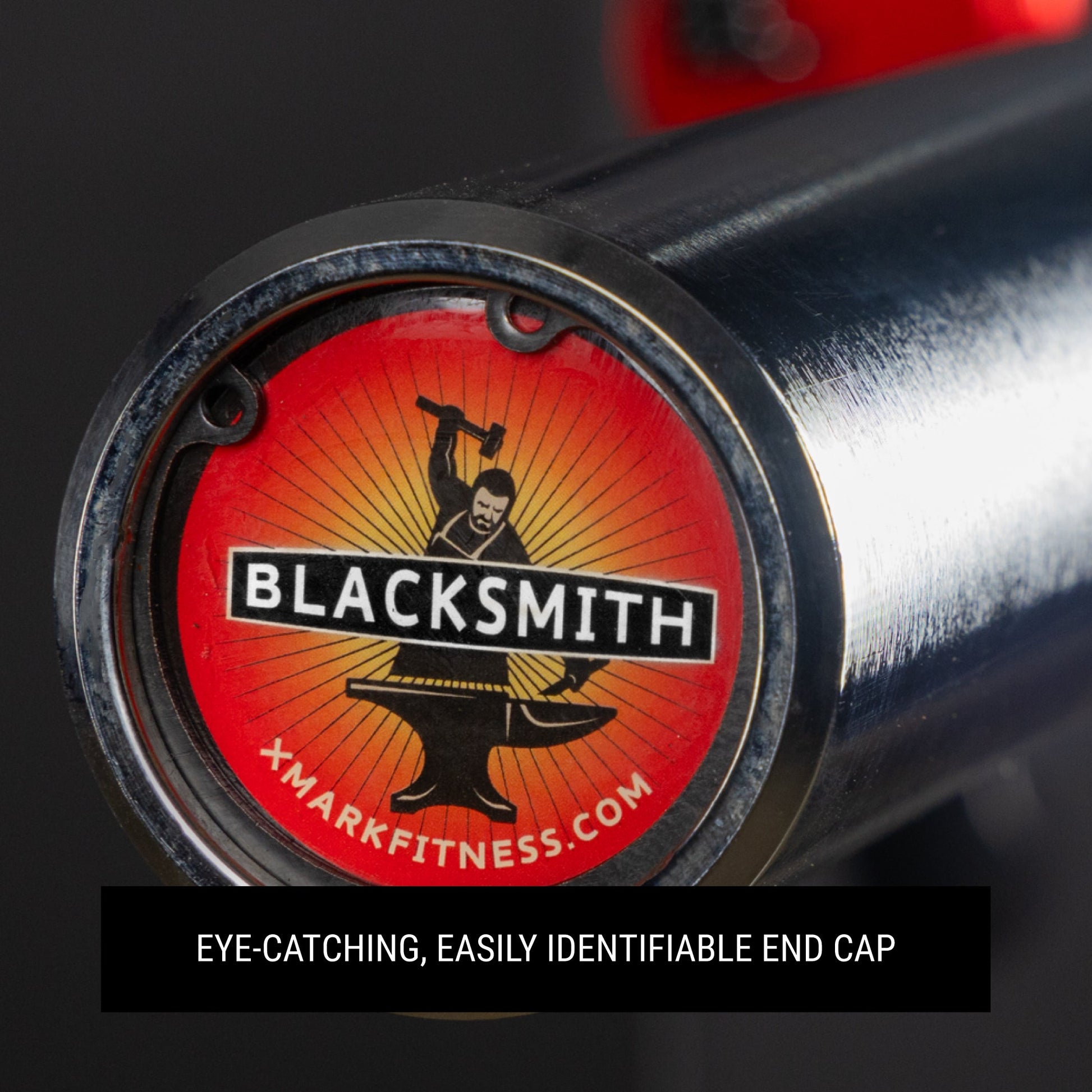 Close-up of the Blacksmith 7ft Olympic Barbell end cap showcasing its vibrant logo and durable design.