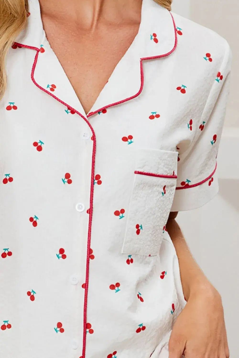 Cherry Print Collared Neck Top and Shorts Lounge Set close-up showing buttoned top with pocket detail.