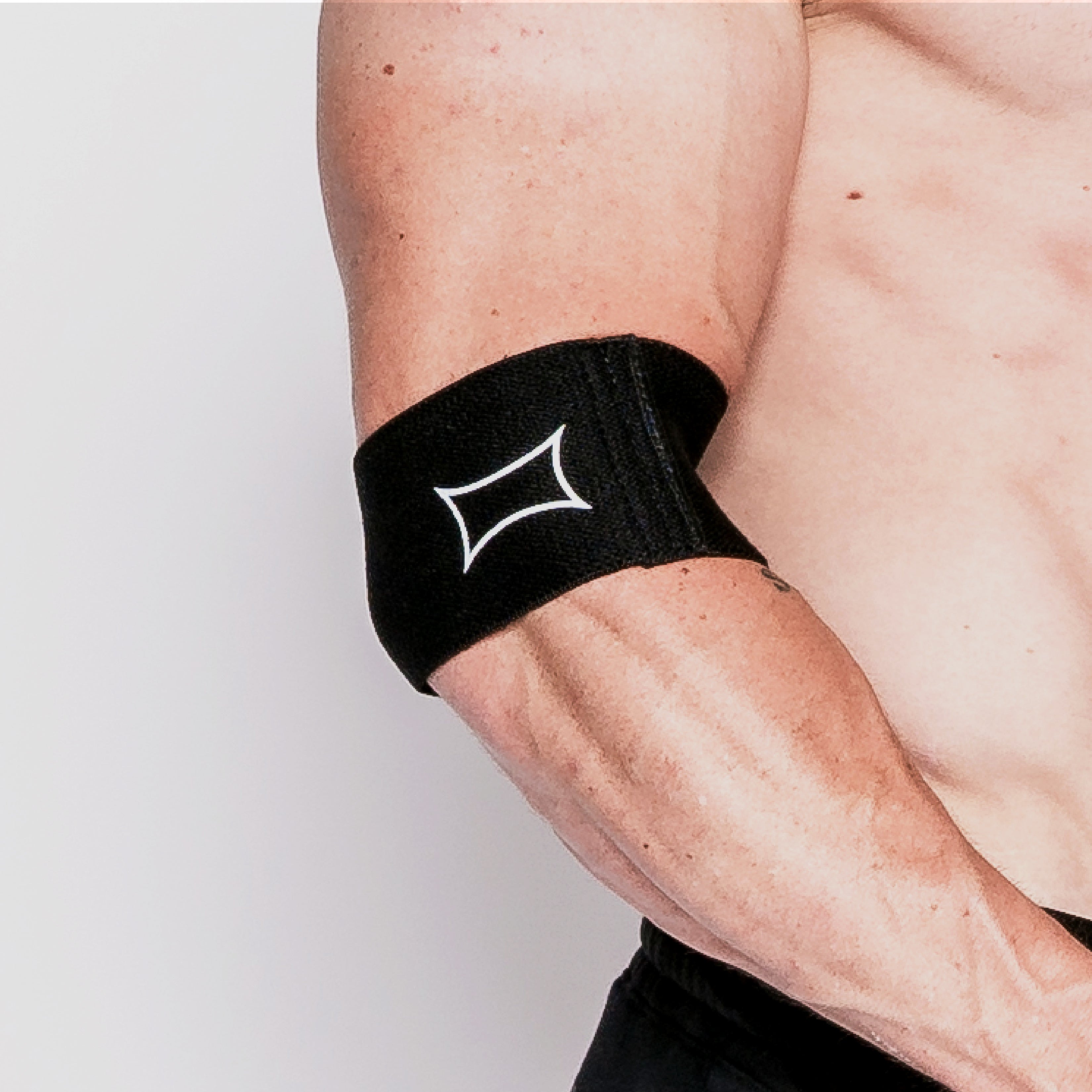 Compression Cuff providing targeted support on an athlete's arm, ideal for joint discomfort relief.