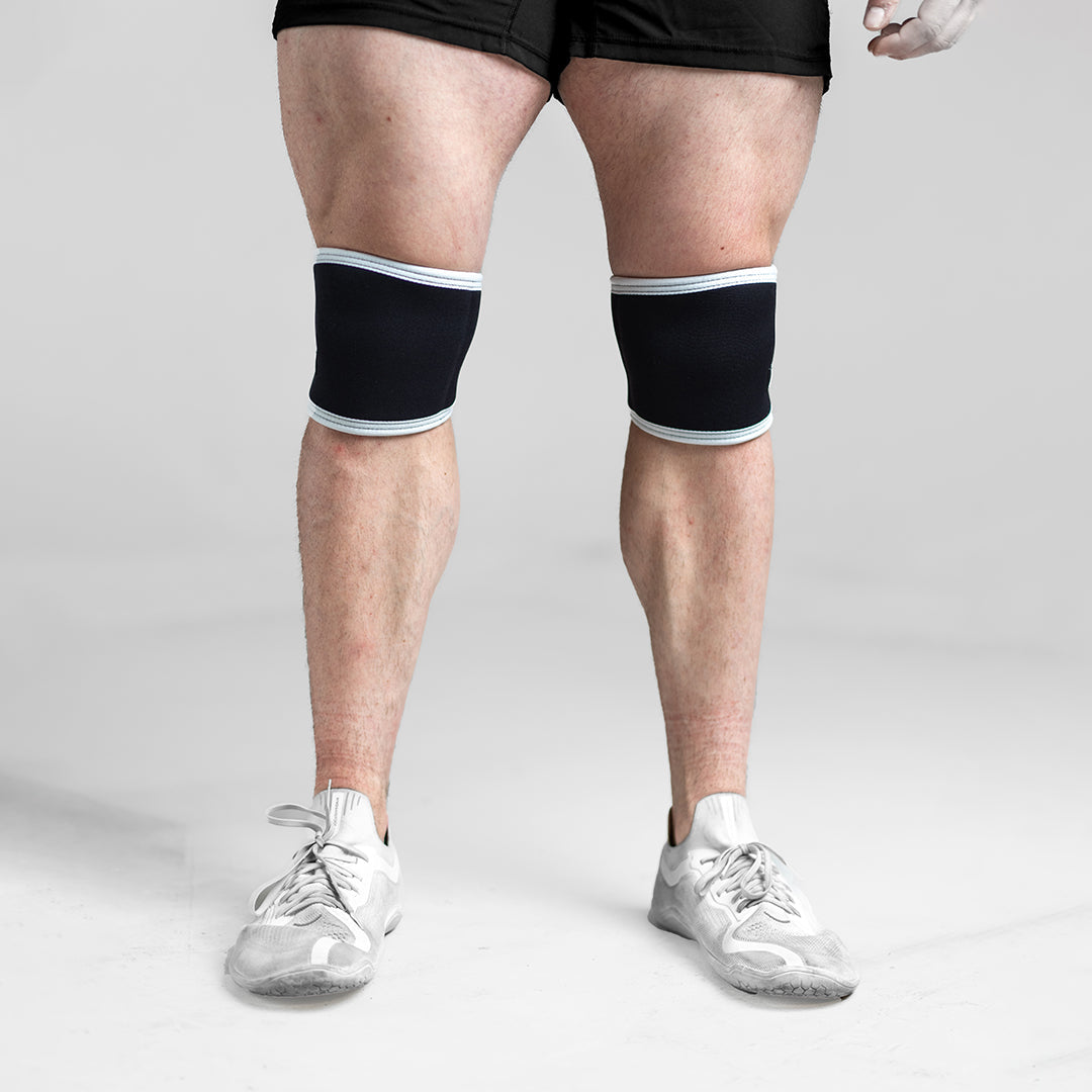 Image of a person wearing Raw Knee Sleeves, showcasing their compact design and compression for effective knee support.