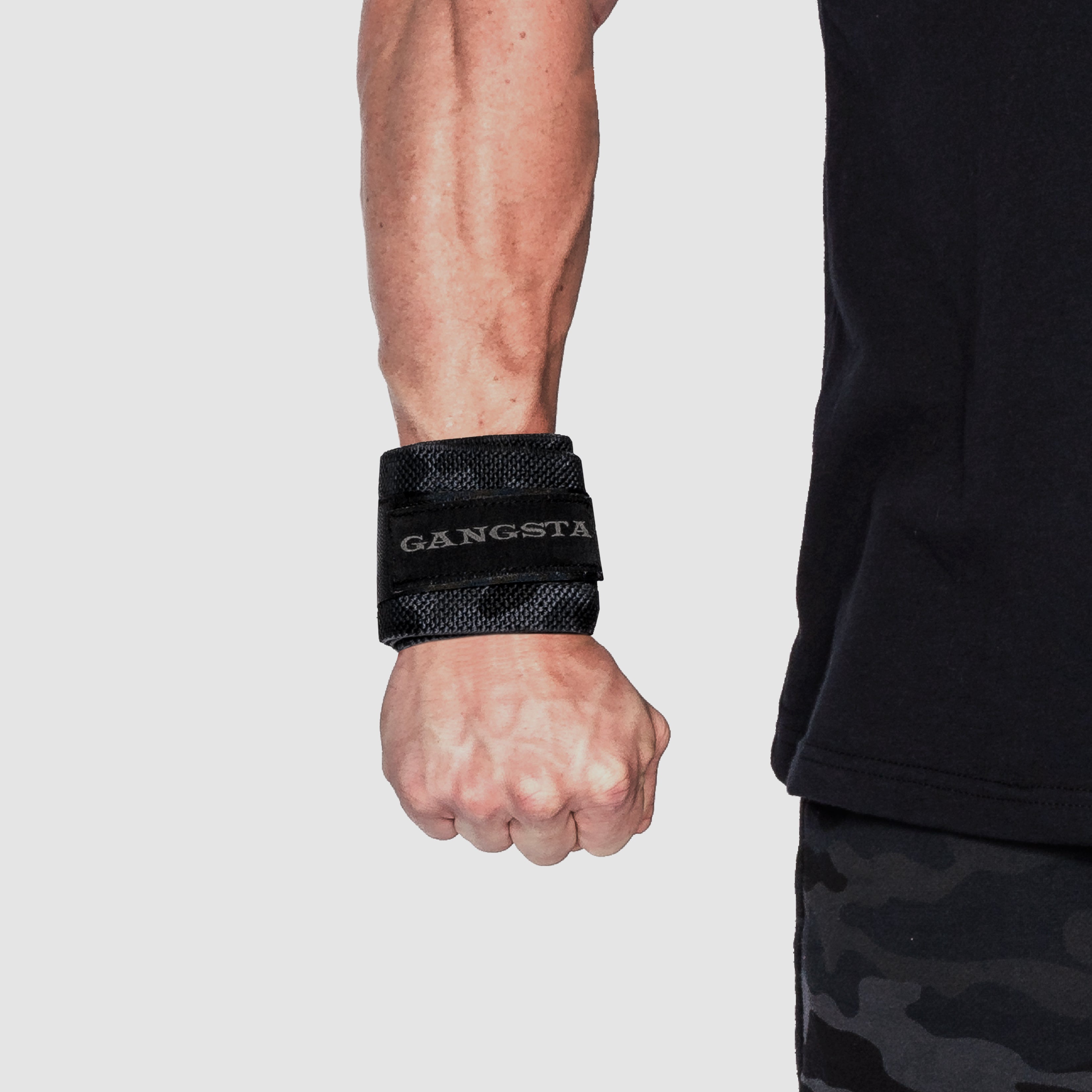 Gangsta Wraps Wrist Wraps worn on a wrist for support during weightlifting and strength training.