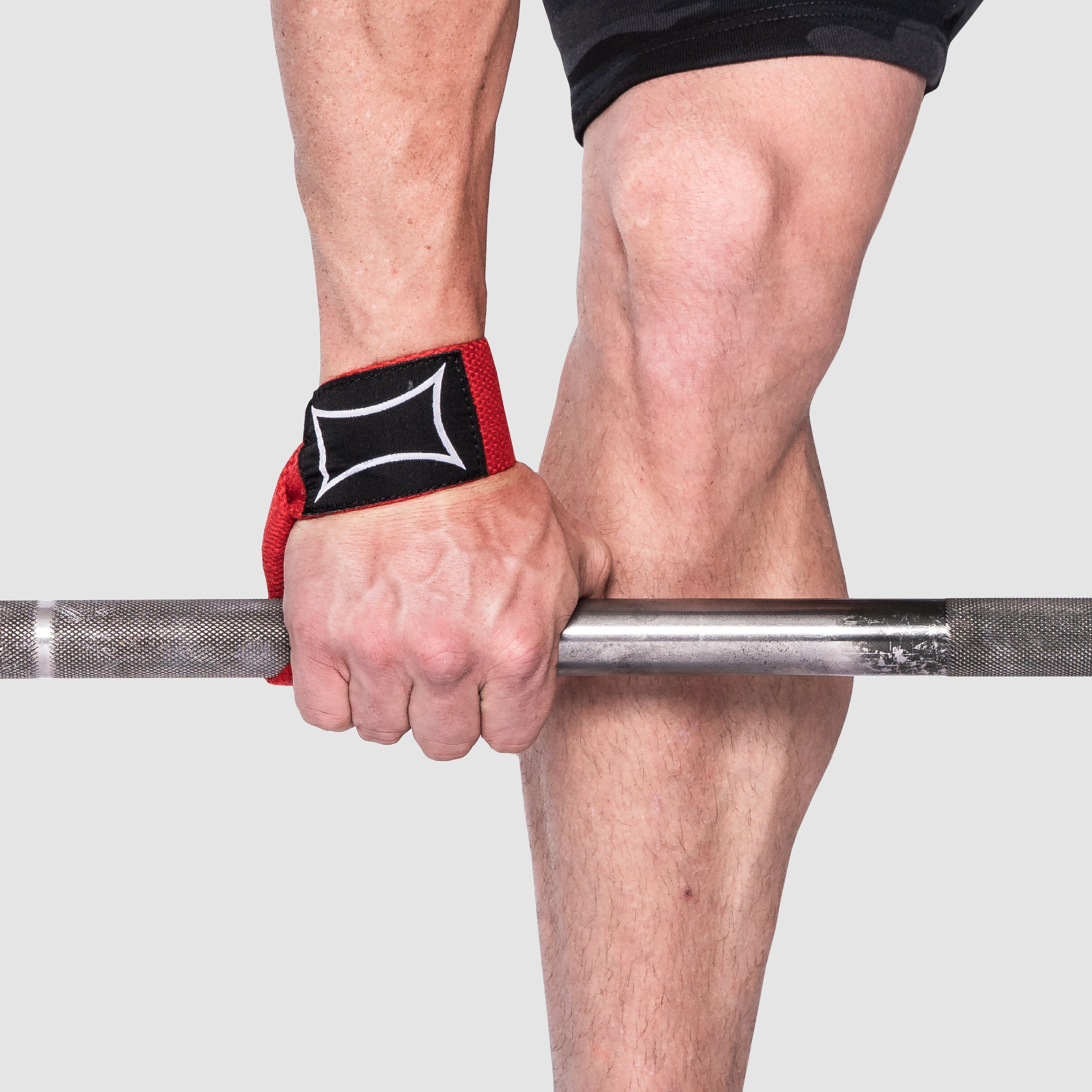 Person using Heavy Duty Lifting Straps while gripping a barbell, showcasing solid grip and support for lifting.