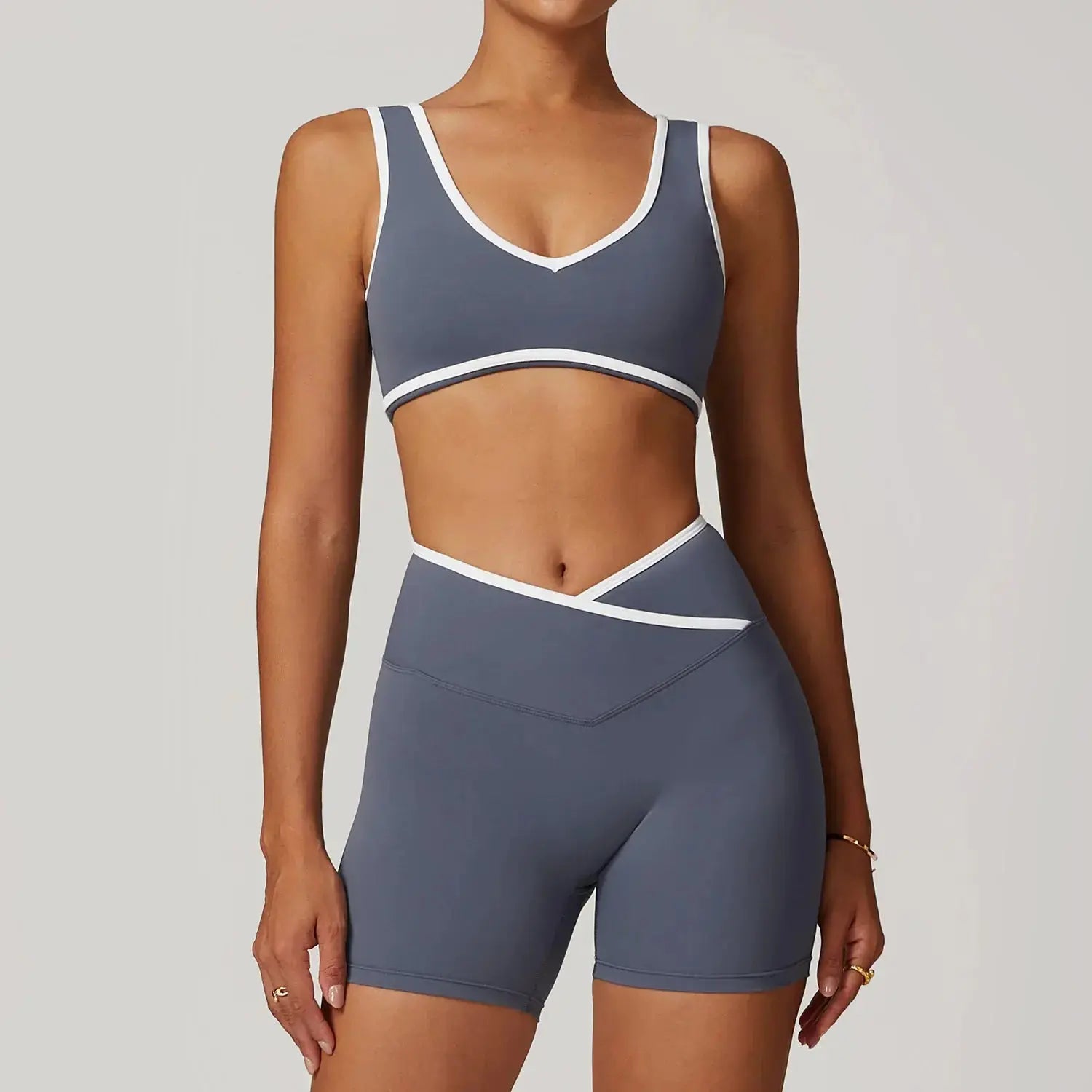 Seamless Yoga Flairé Cross High Waist Workout Set showcasing a stylish sports bra and high-waisted shorts in gray.