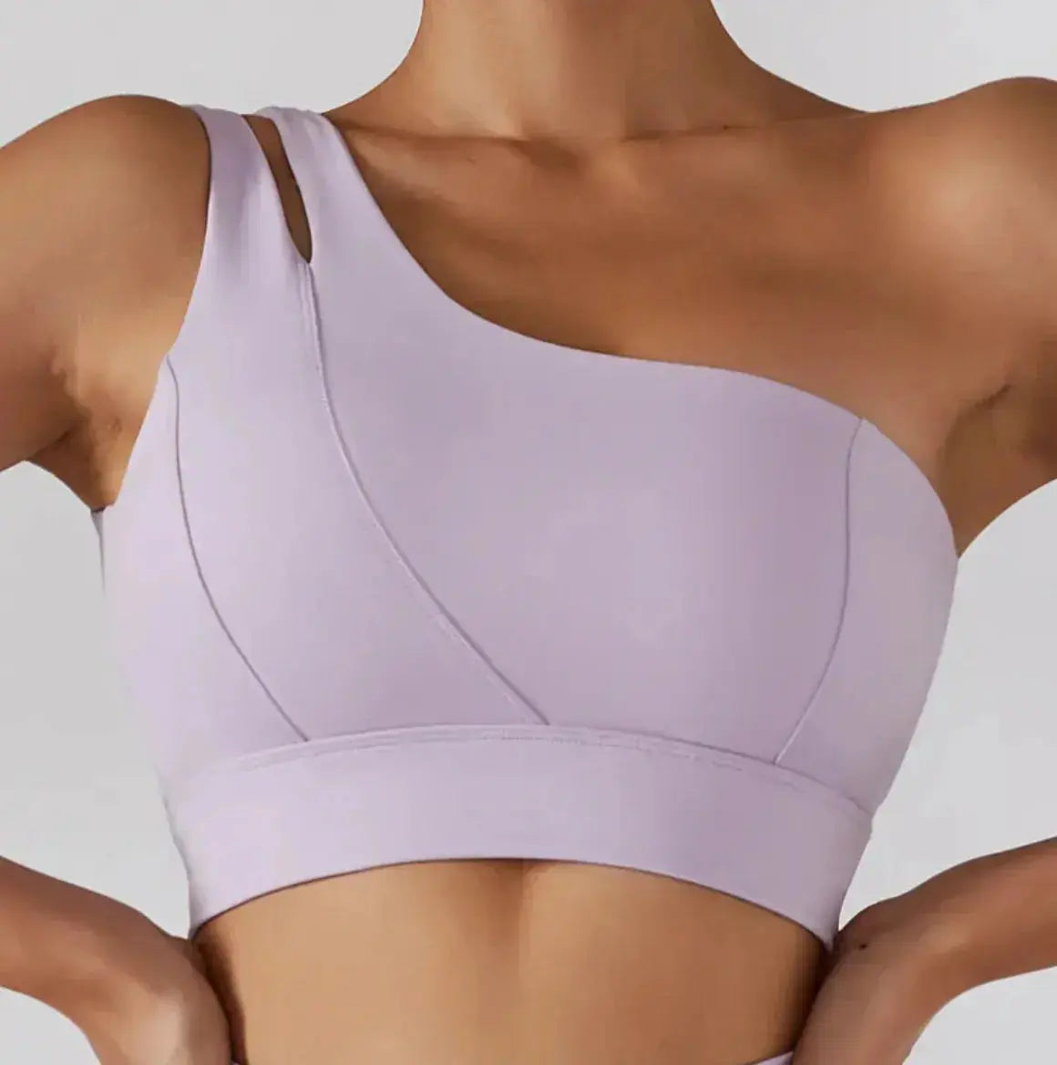 One Shoulder Flaire Ribbed Workout Bra in soft lavender with stylish one-shoulder design.