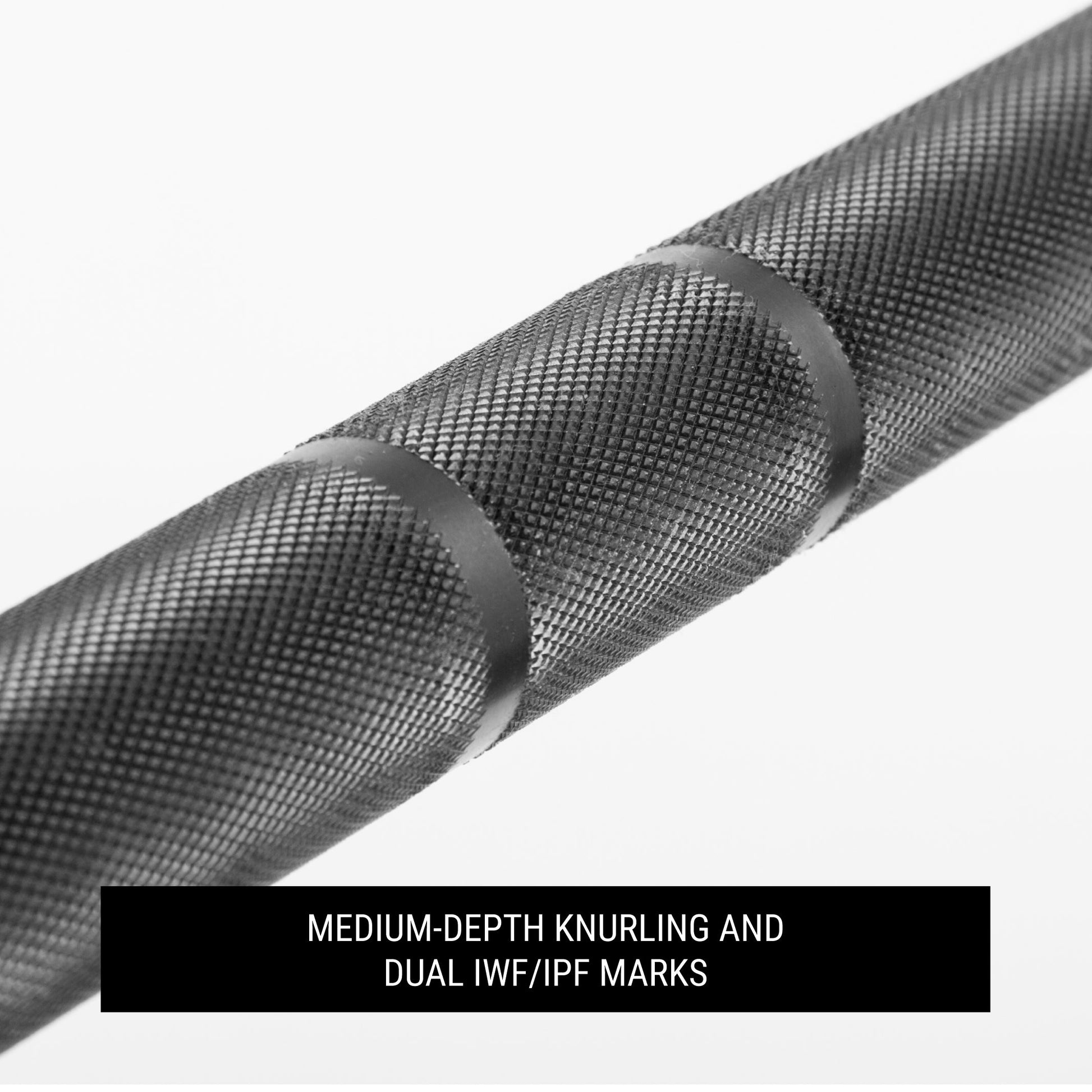 Medium-depth knurling and dual IWF/IPF marks on the Lumberjack 7ft Olympic Beginner Bar for enhanced grip.
