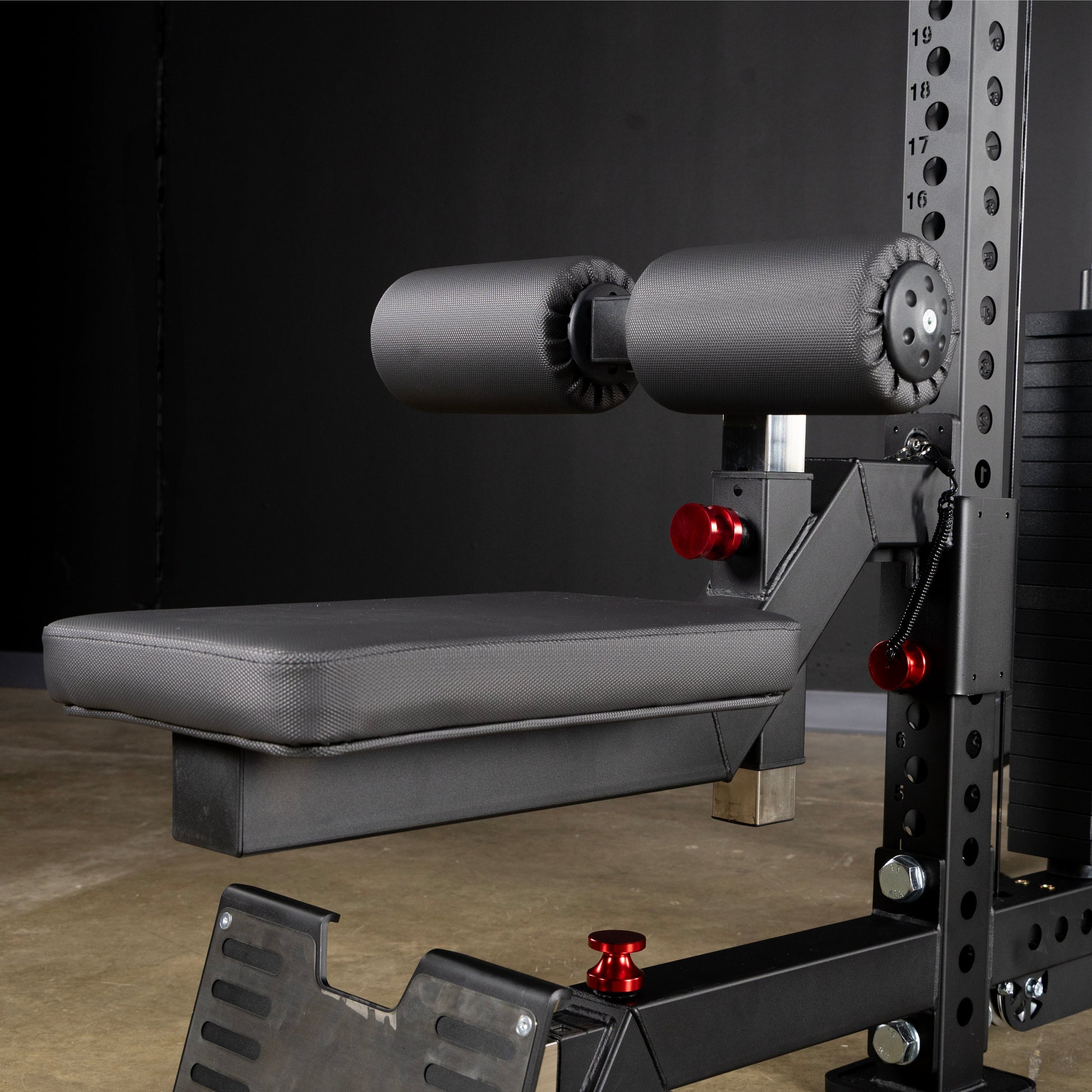 Lat Pulldown Seat Attachment showing padded seat and adjustable roller pads for secure fit in gym equipment.
