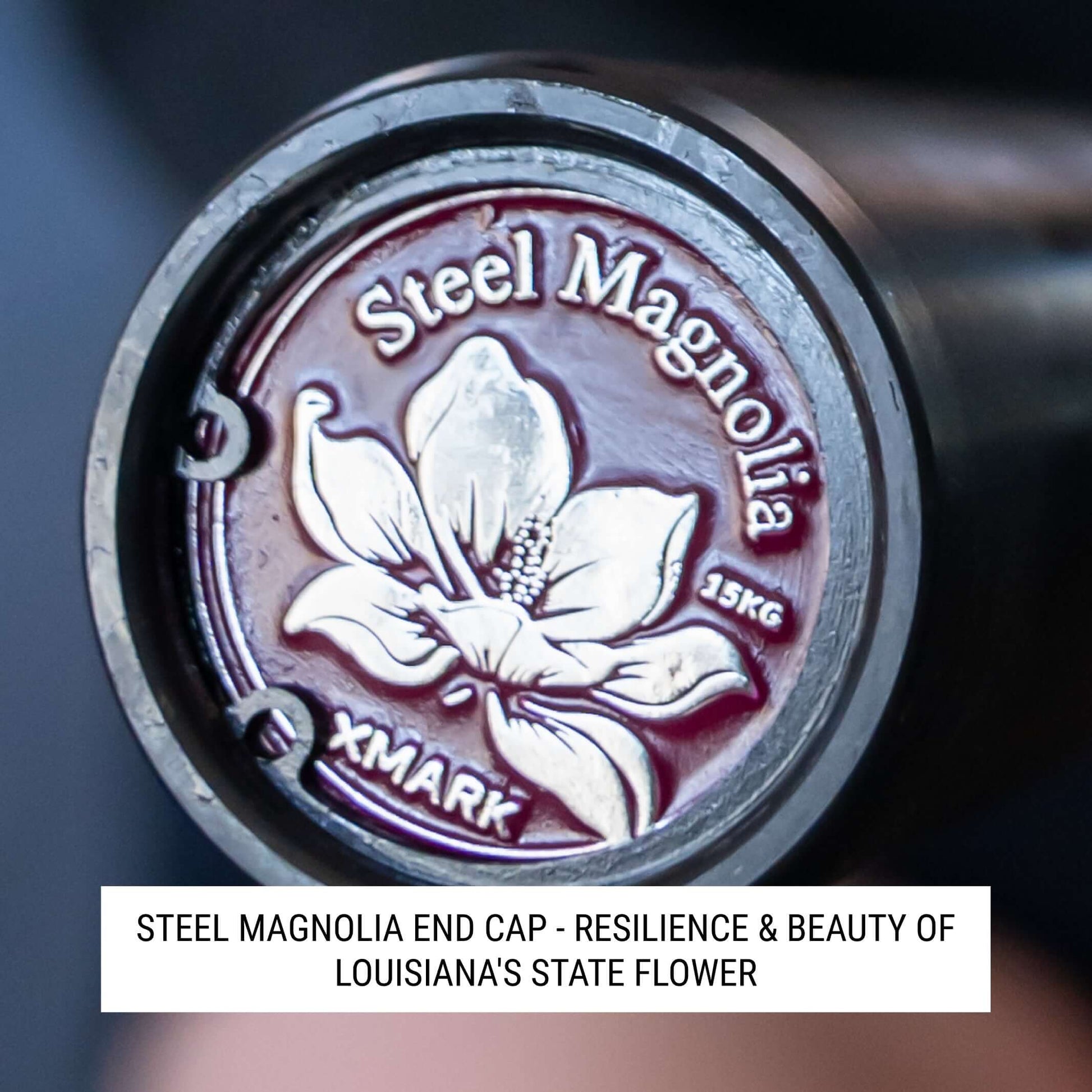 Steel Magnolia IWF Women’s Training Bar end cap showcasing the resilience and beauty of Louisiana's state flower.