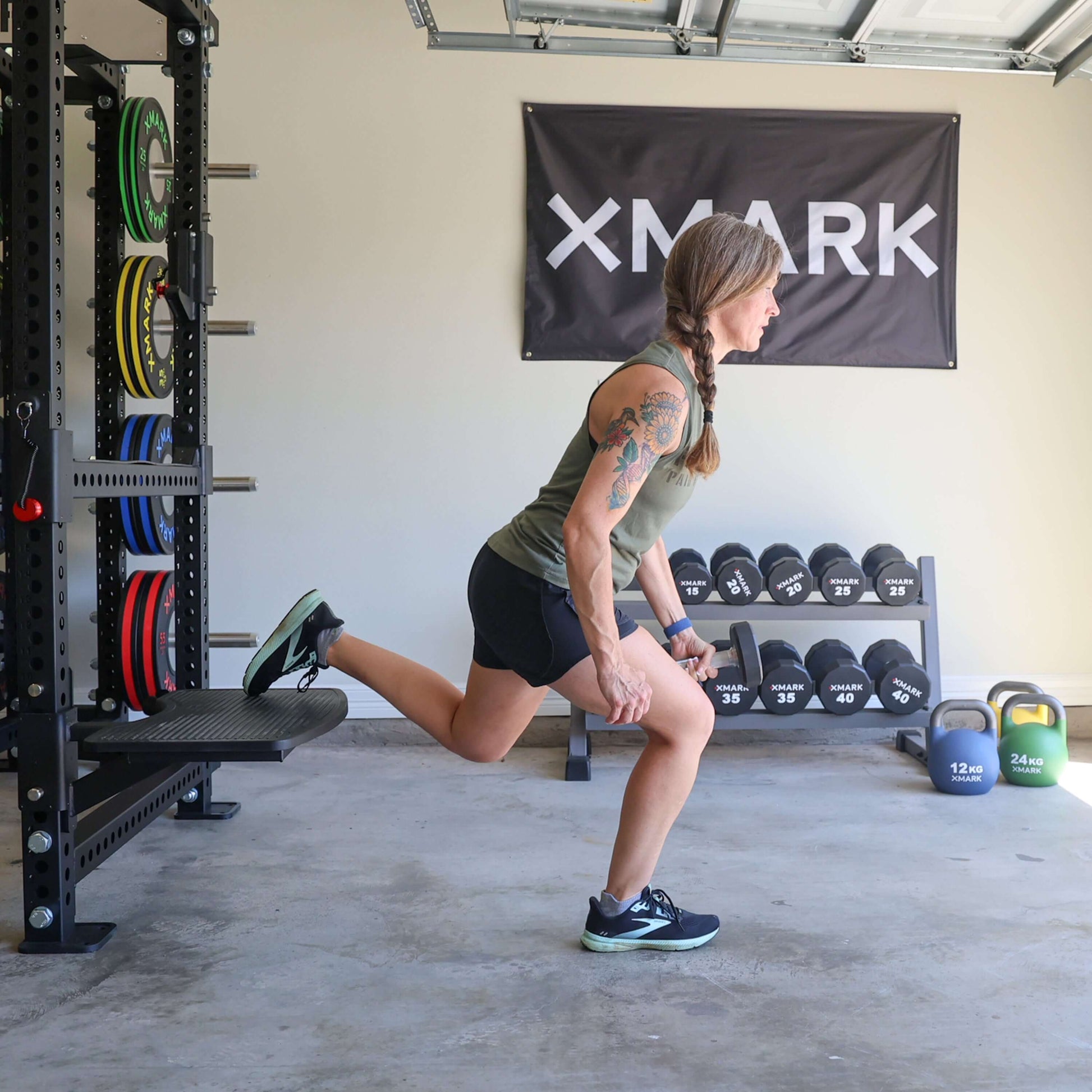 Viper Multi-Purpose Step Attachment in use for Bulgarian split squats with weights in a gym setting.