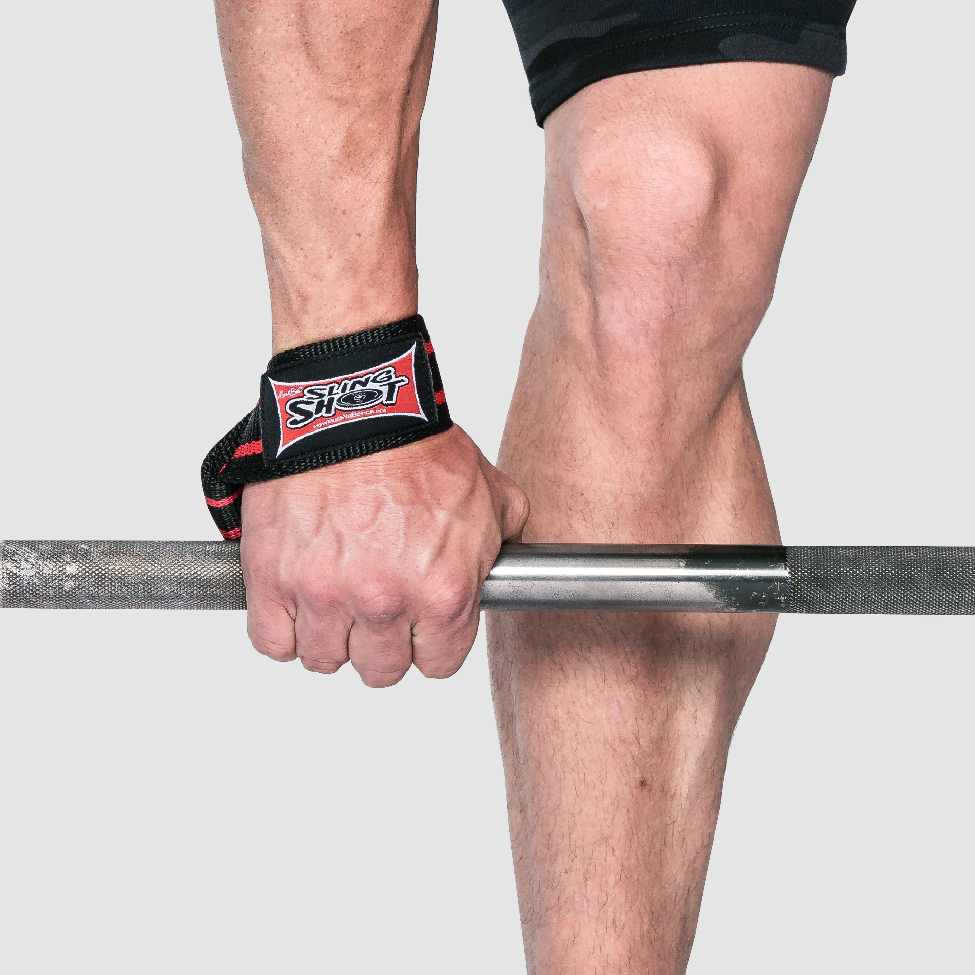 Person using Super Heavy Duty Lifting Straps while holding a barbell, enhancing grip for weightlifting.