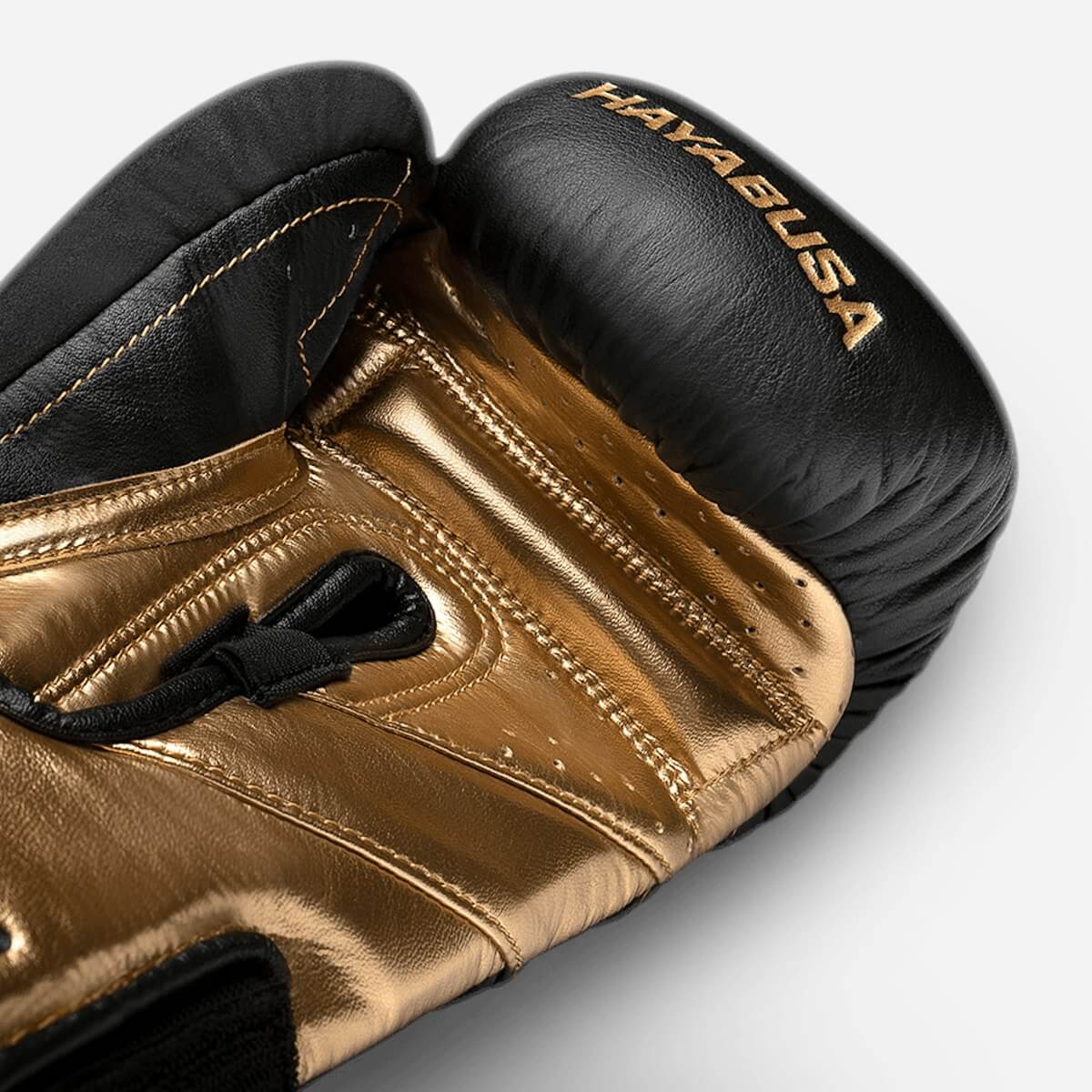 Hayabusa T3 Performance Boxing Gloves in gold and black showcasing premium craftsmanship and superior wrist support.