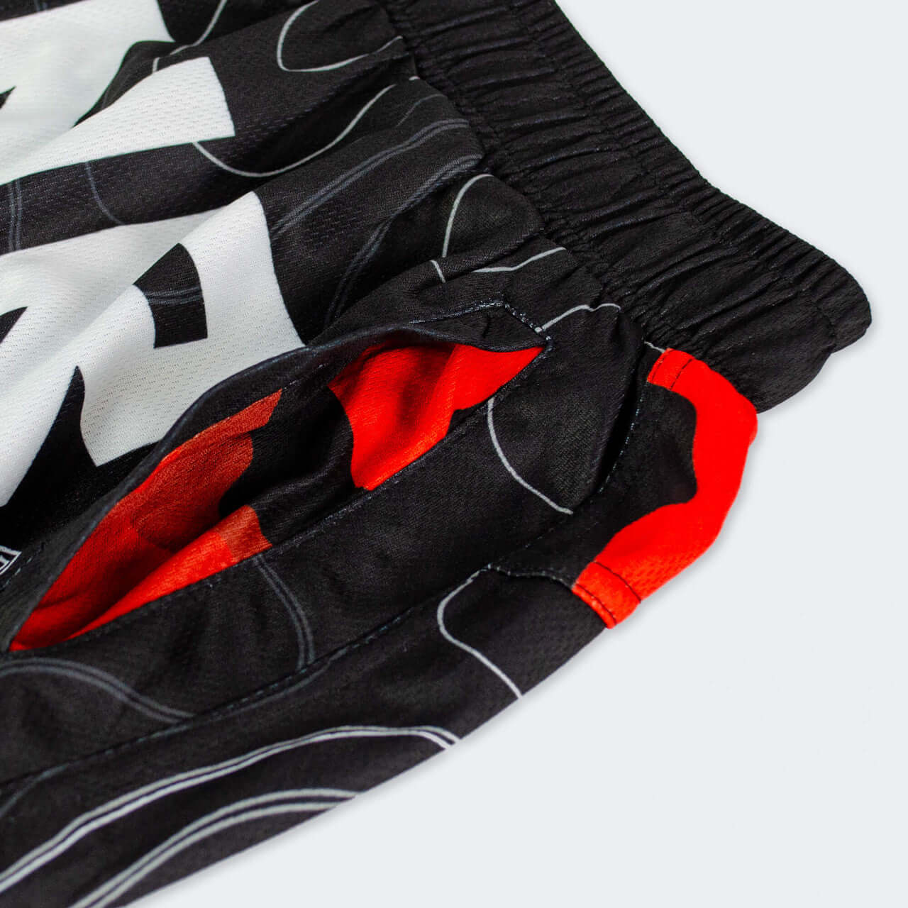 Close-up of FORM TRAINING SHORTS by Combat Corner showcasing fabric detail and vibrant colors.