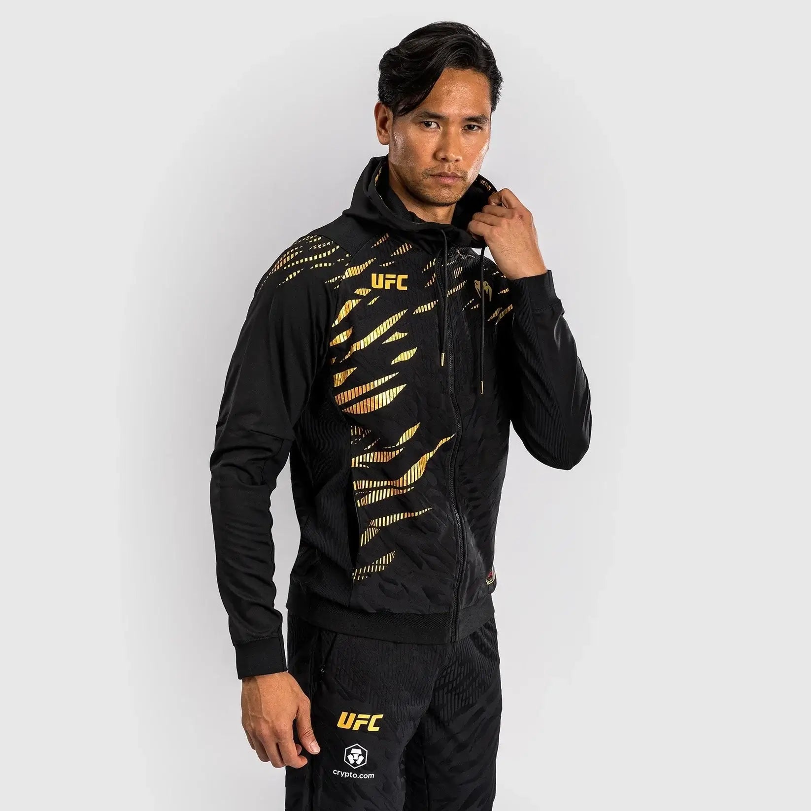 UFC Fusion Authentic Fight Night Walkout Hoodie worn by a model showcasing its stylish design.