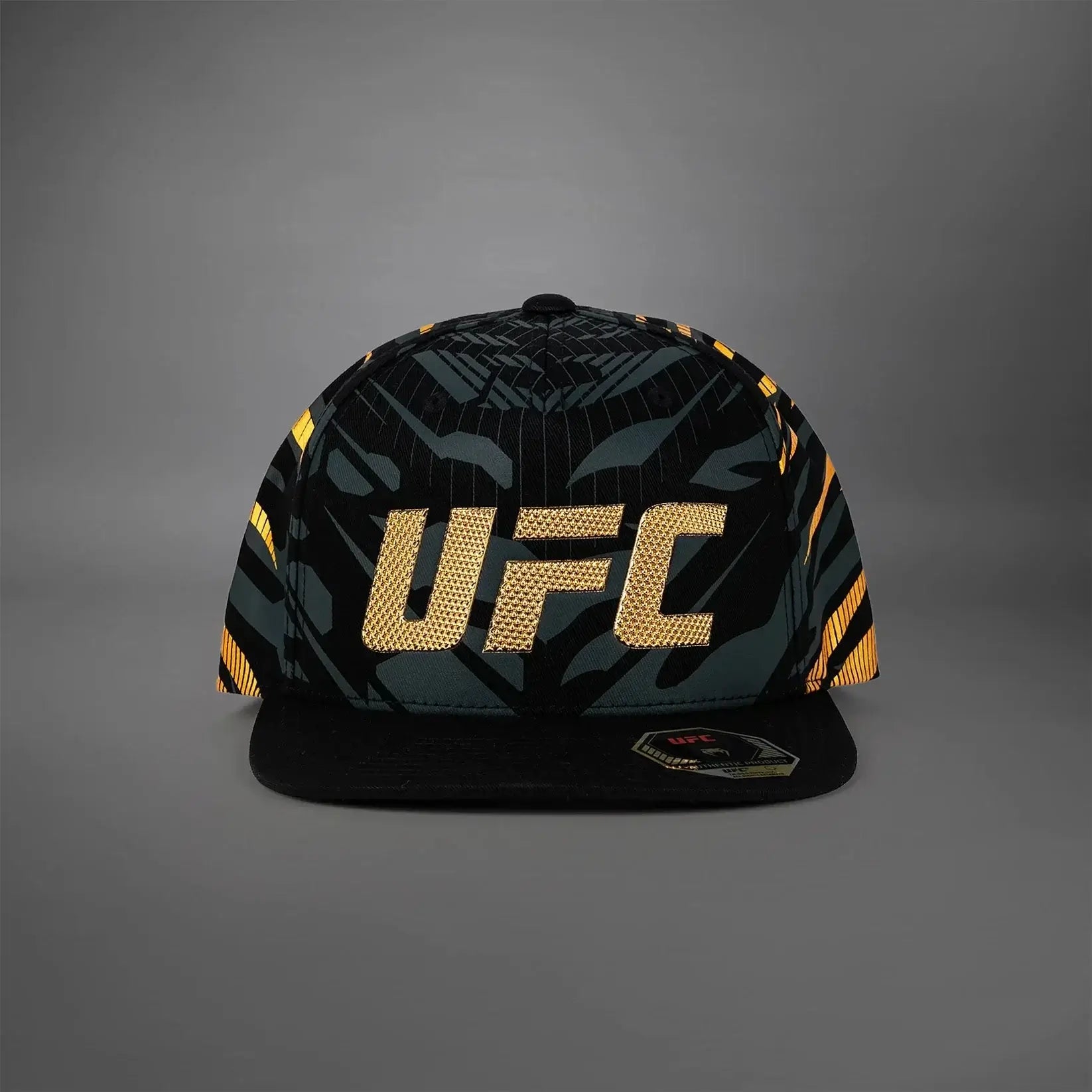 UFC Fusion Authentic Fight Night Snapback Hat featuring a bold black and gold design.