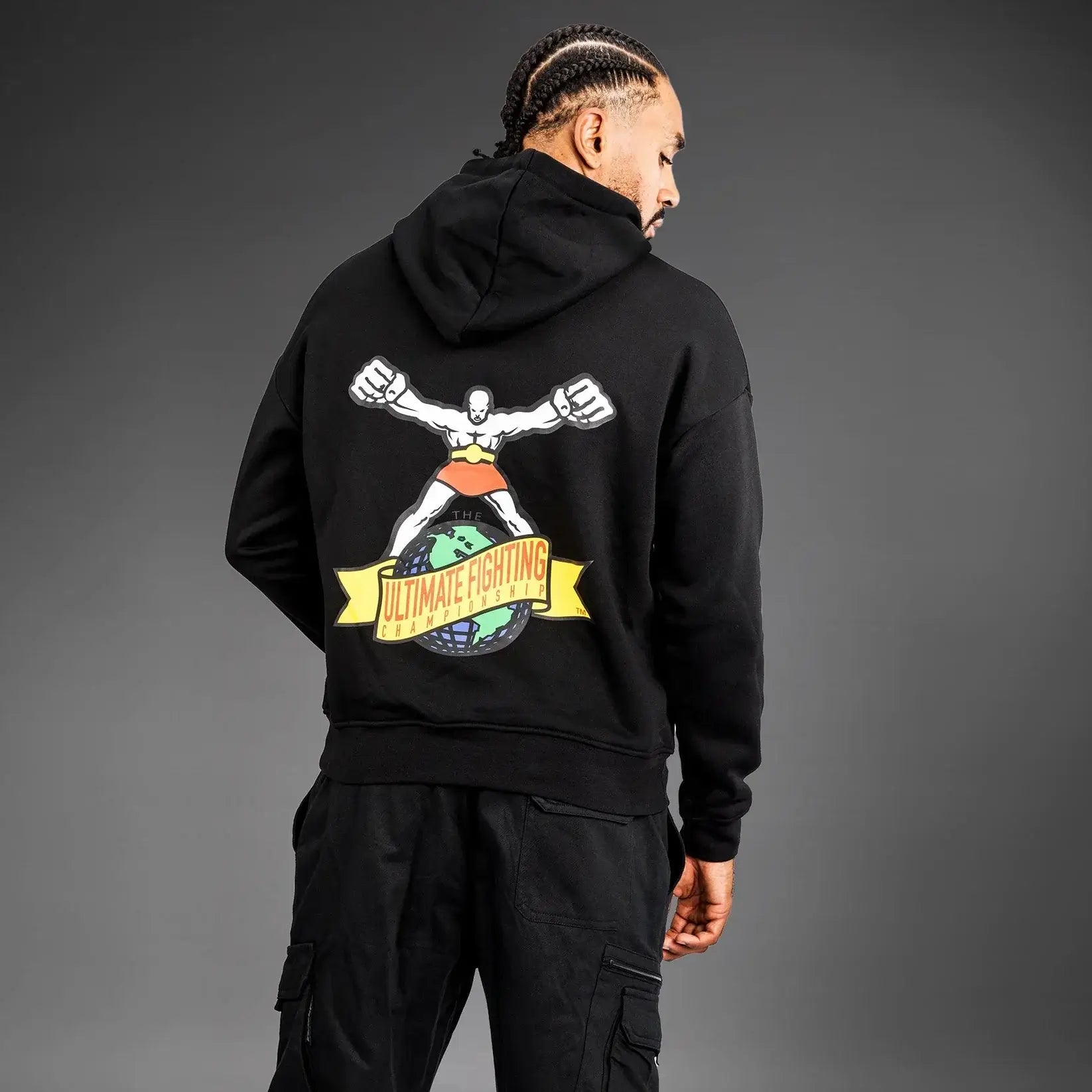 Man wearing UFC Ulti-Man Competition Hoodie showcasing the iconic logo on the back.