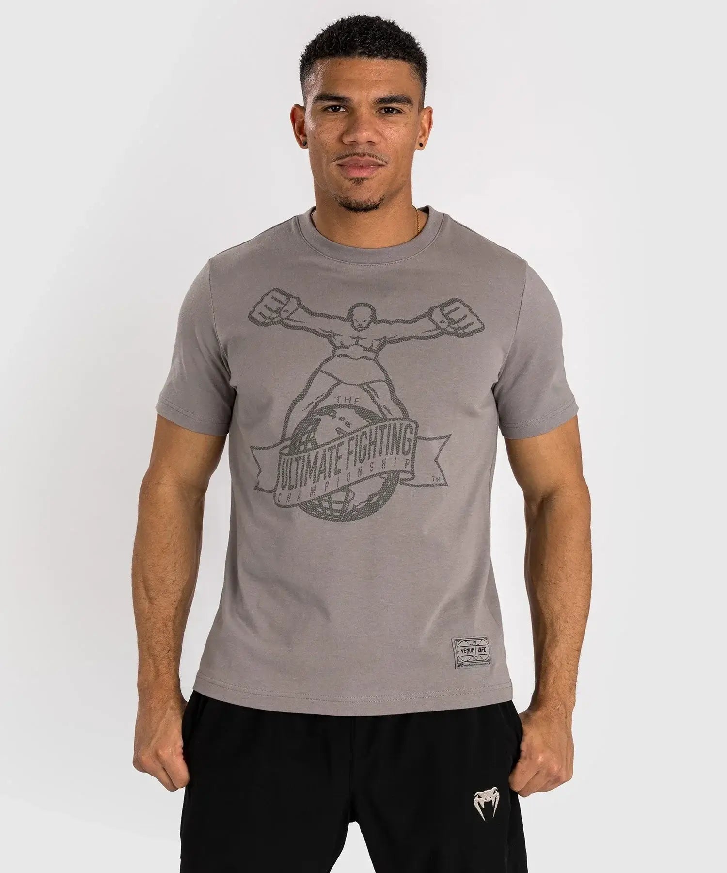 UFC Ulti-Man Performance T-Shirt on male model showcasing iconic logo design, perfect for UFC fans and athletes.
