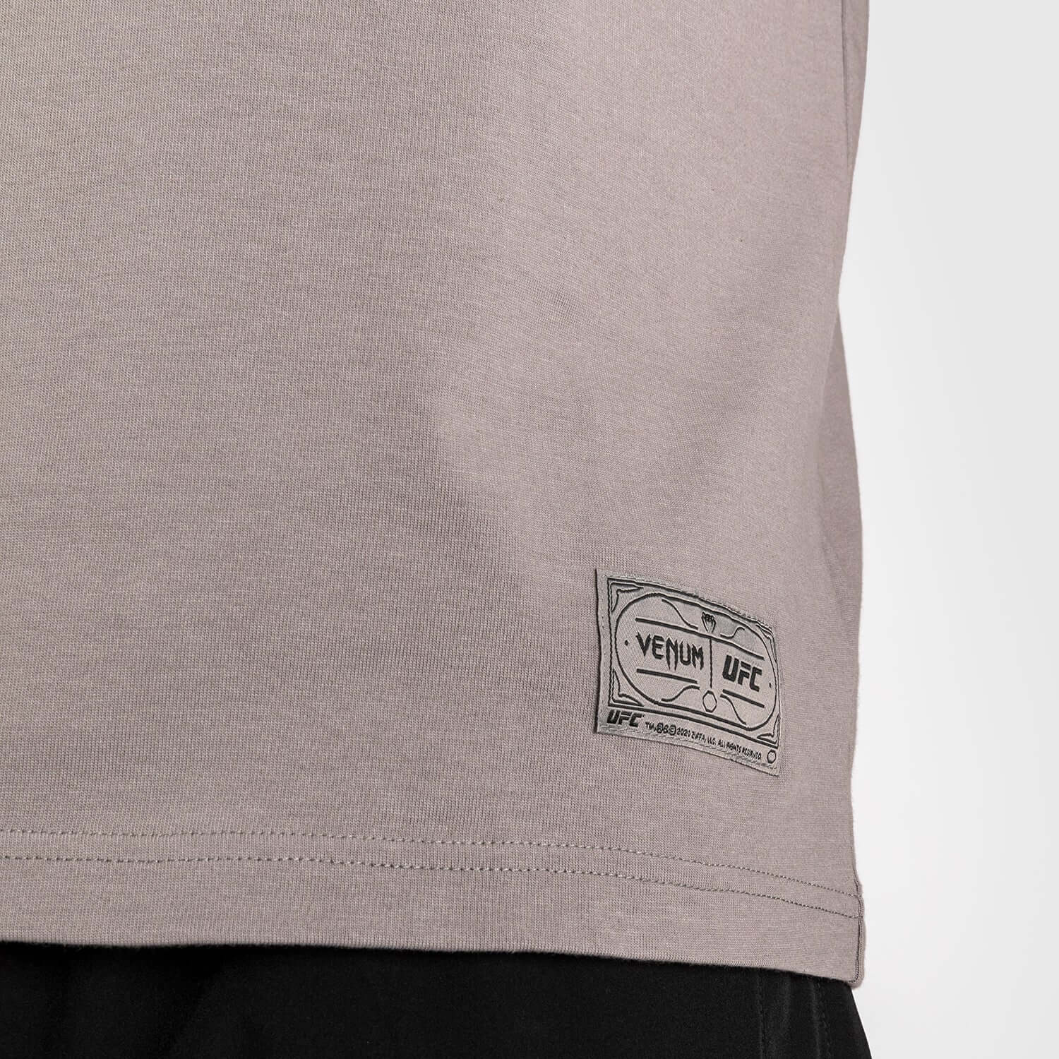 UFC Ulti-Man Performance T-Shirt featuring Venum logo patch on the hip for style and comfort.