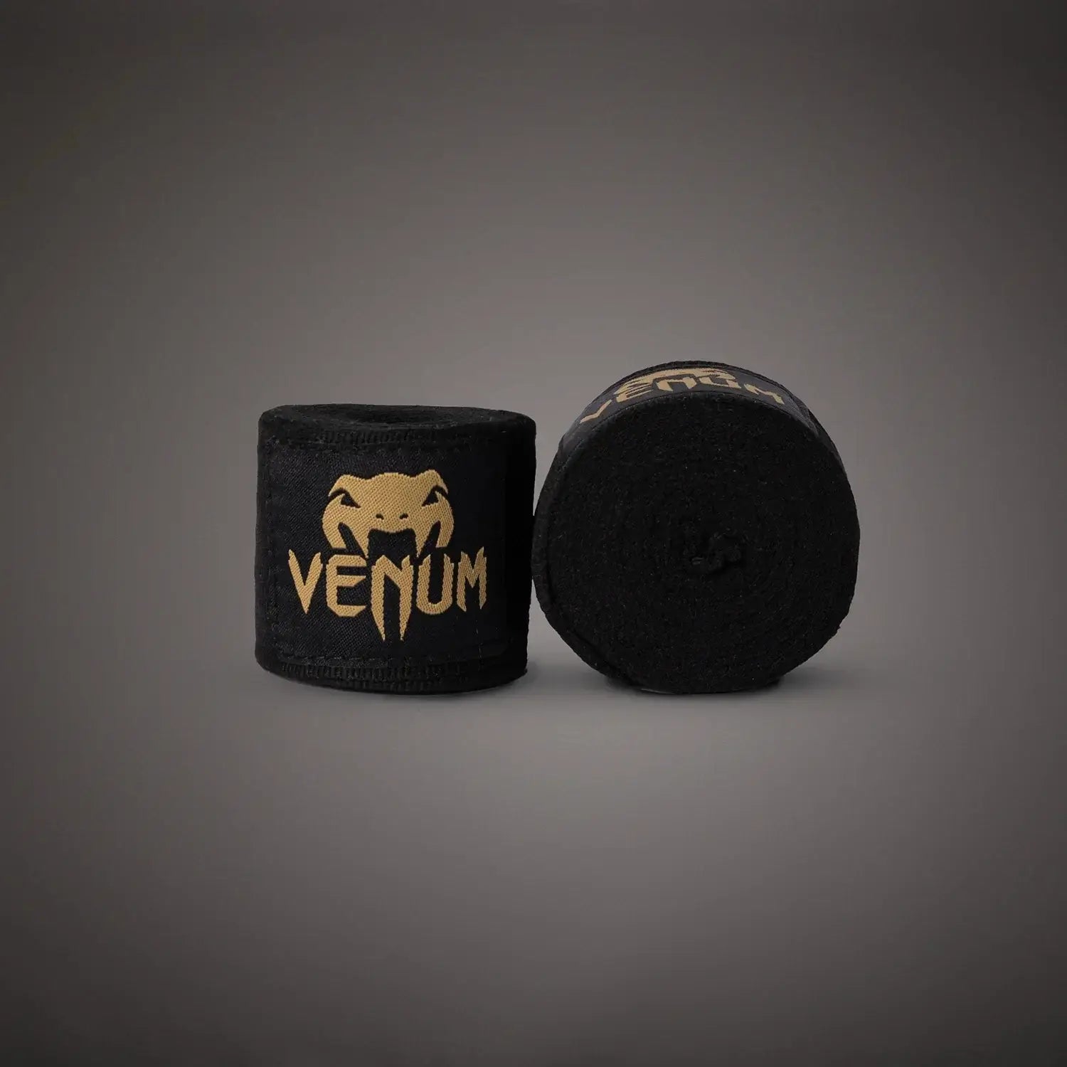 Venum Kontact Boxing Handwraps displayed in black with a gold logo, ideal for boxers and MMA fighters.